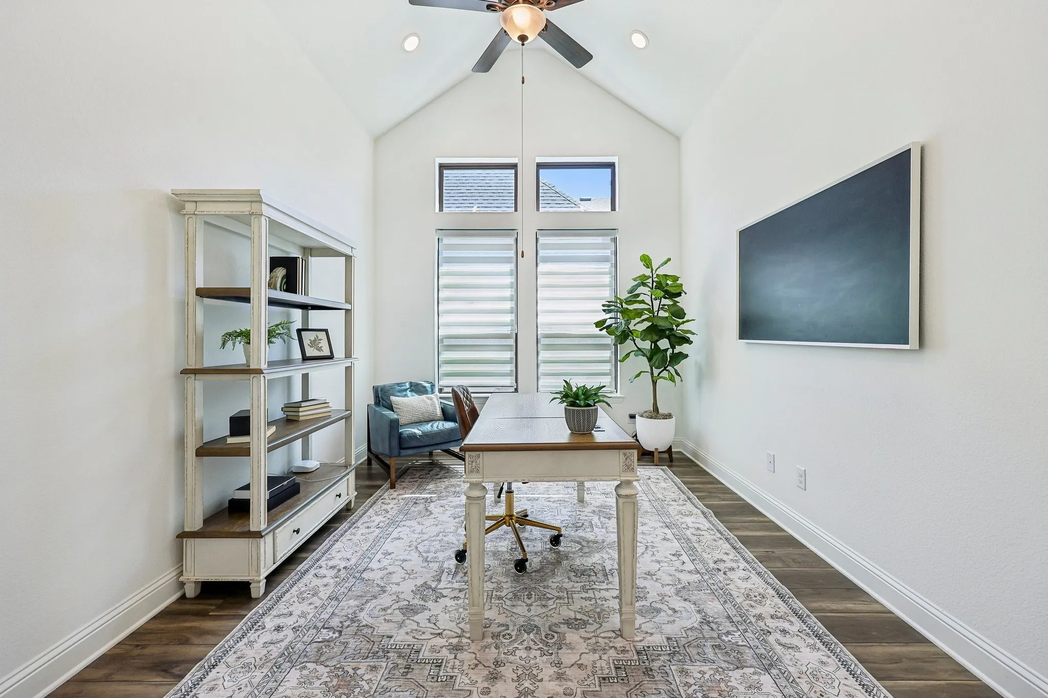 Vaulted ceiling with a ceiling fan, recessed lighting, wood-finish flooring, and multiple windows with blinds
