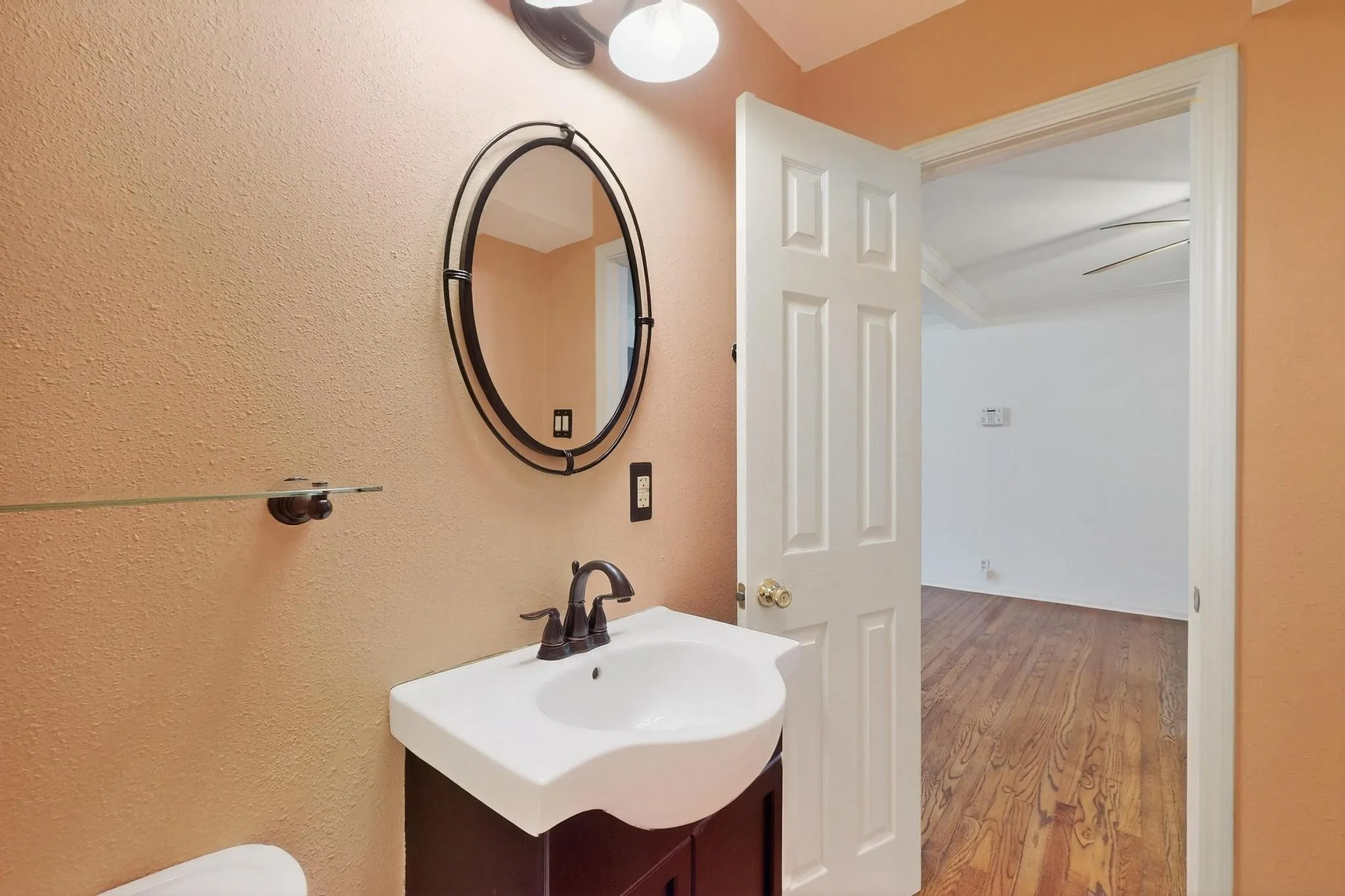 Bathroom with vanity and wood finished floors