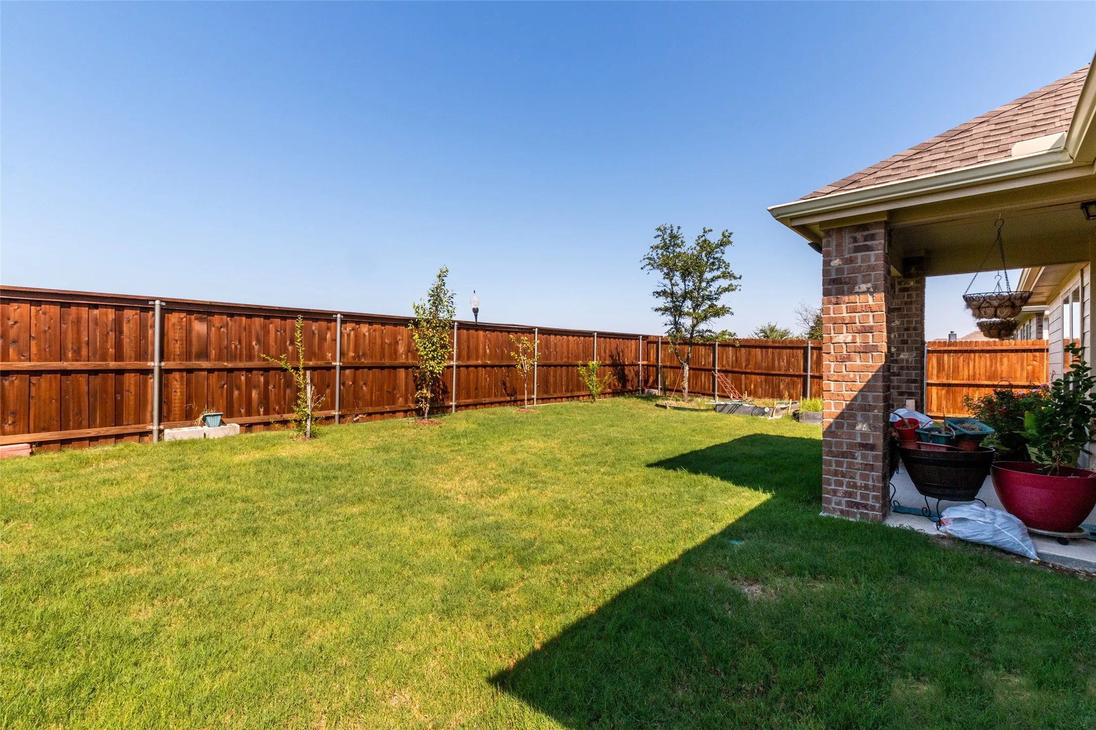 View of fenced backyard