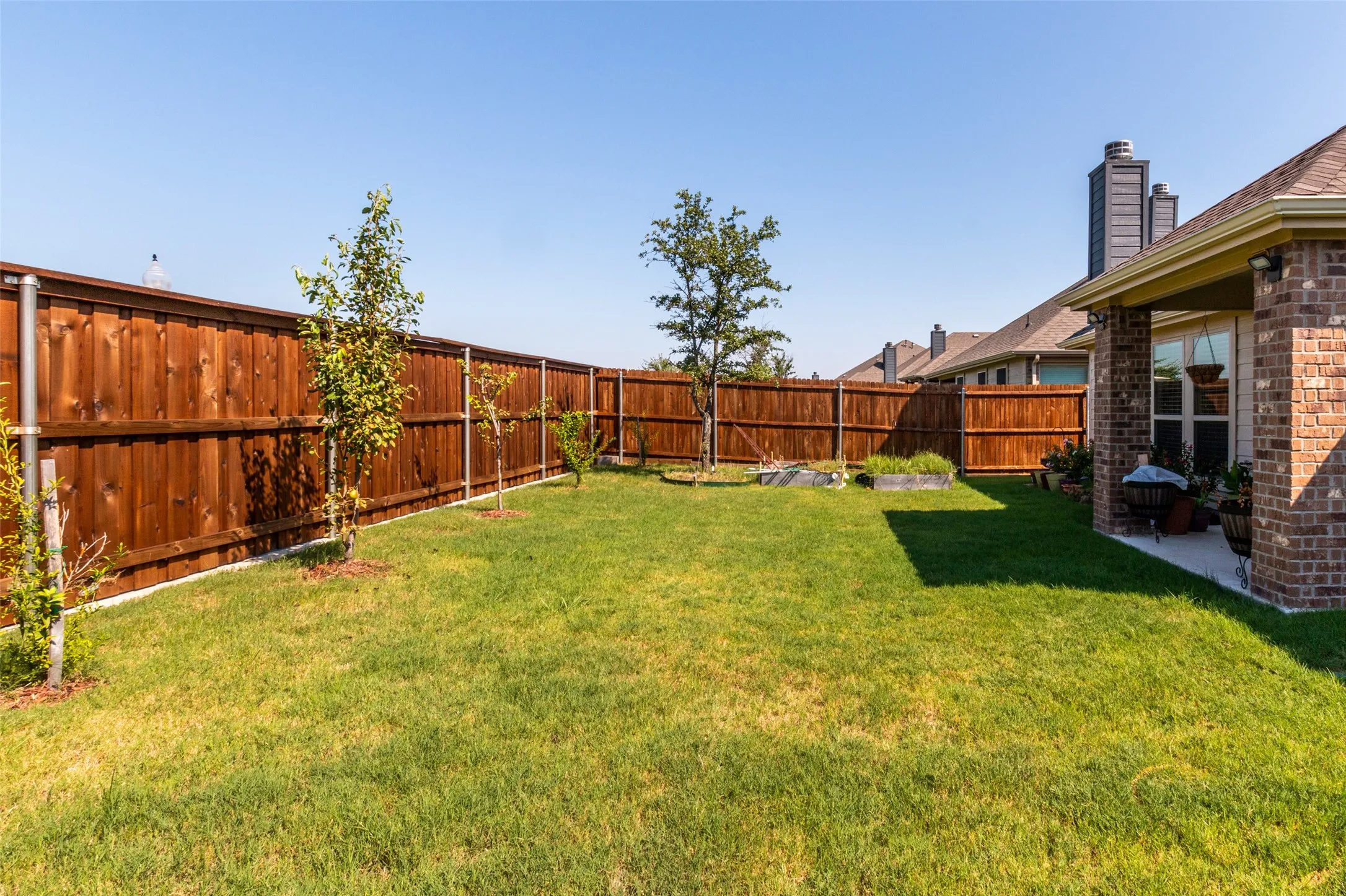View of fenced backyard