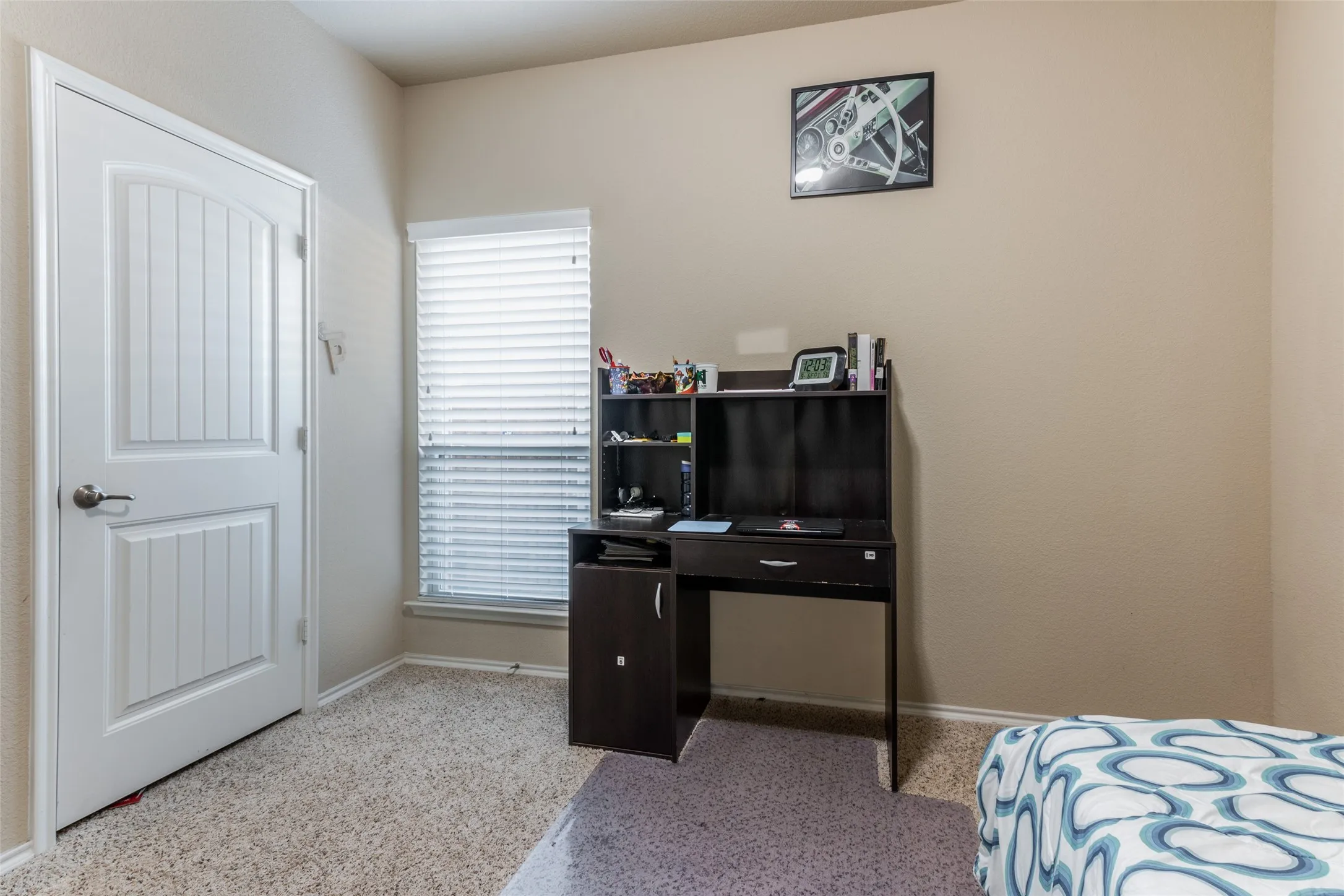 Bedroom featuring baseboards and speckle patterned floor