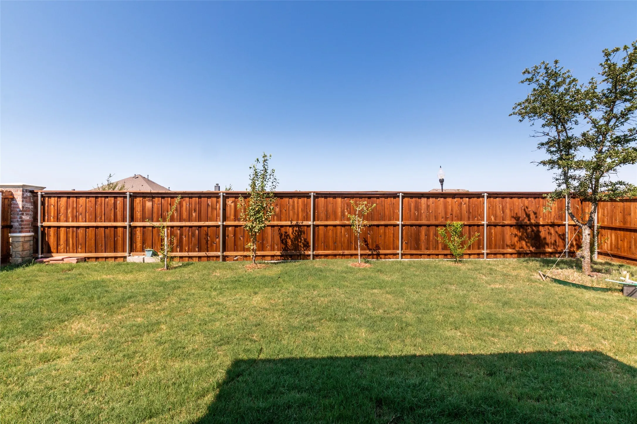 View of fenced backyard