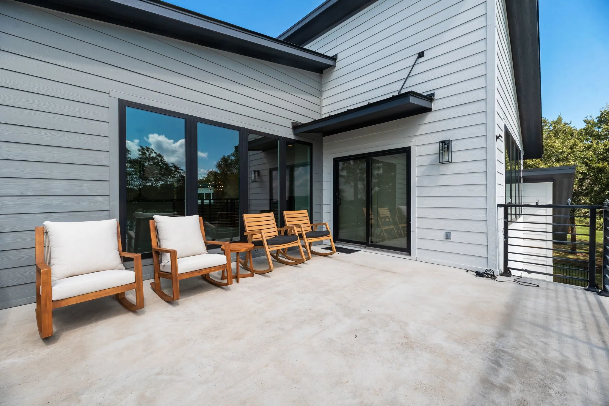 Private second-floor balcony accessed from a secondary bedroom creates an inviting outdoor space for enjoying the peaceful surroundings.