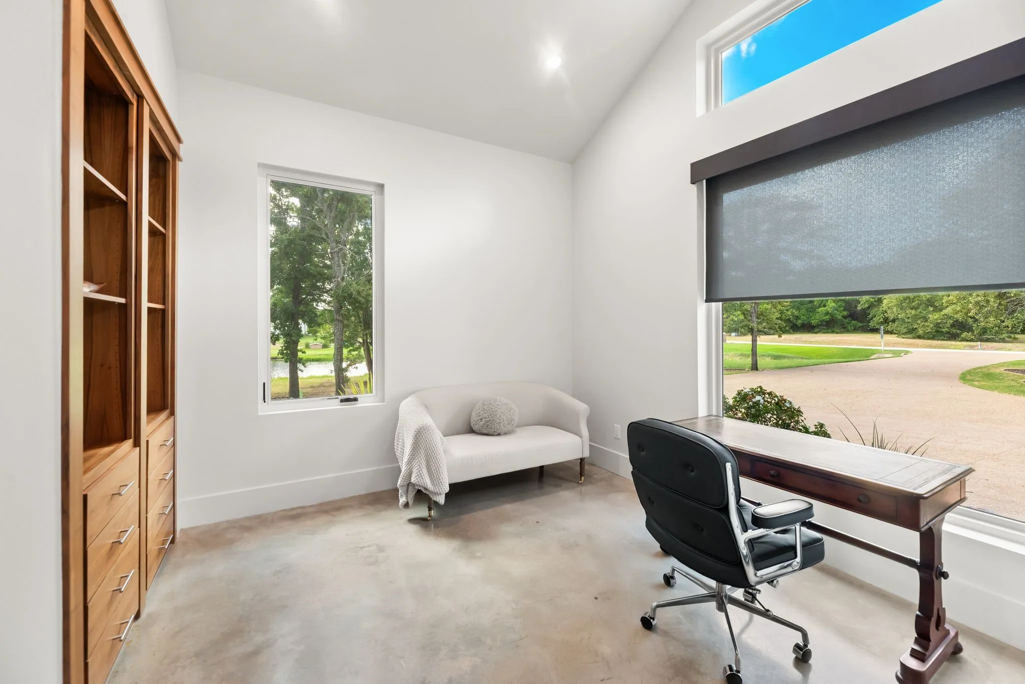 Versatile main-level flex space offers endless possibilities as a home office, reading room, hobby space, exercise room, or cozy retreat tailored to your lifestyle.