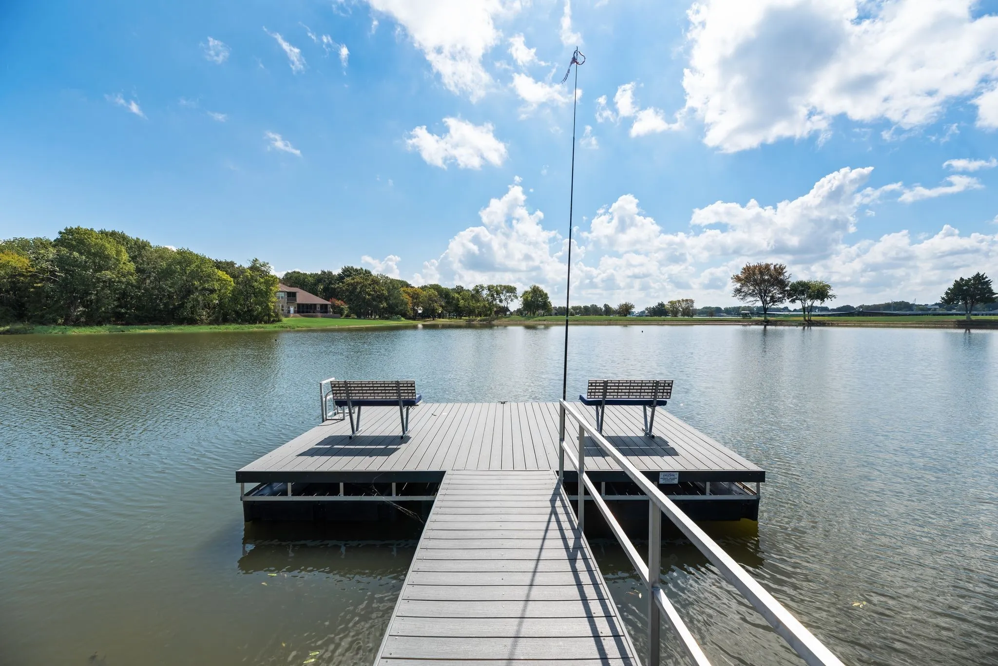 Private uncovered dock provides direct access to the water from the backyard of 708 Clear Water Court in The​​‌​​​​‌​​‌‌​‌‌​​​‌‌​‌​‌​‌​​​‌​​ Shores.