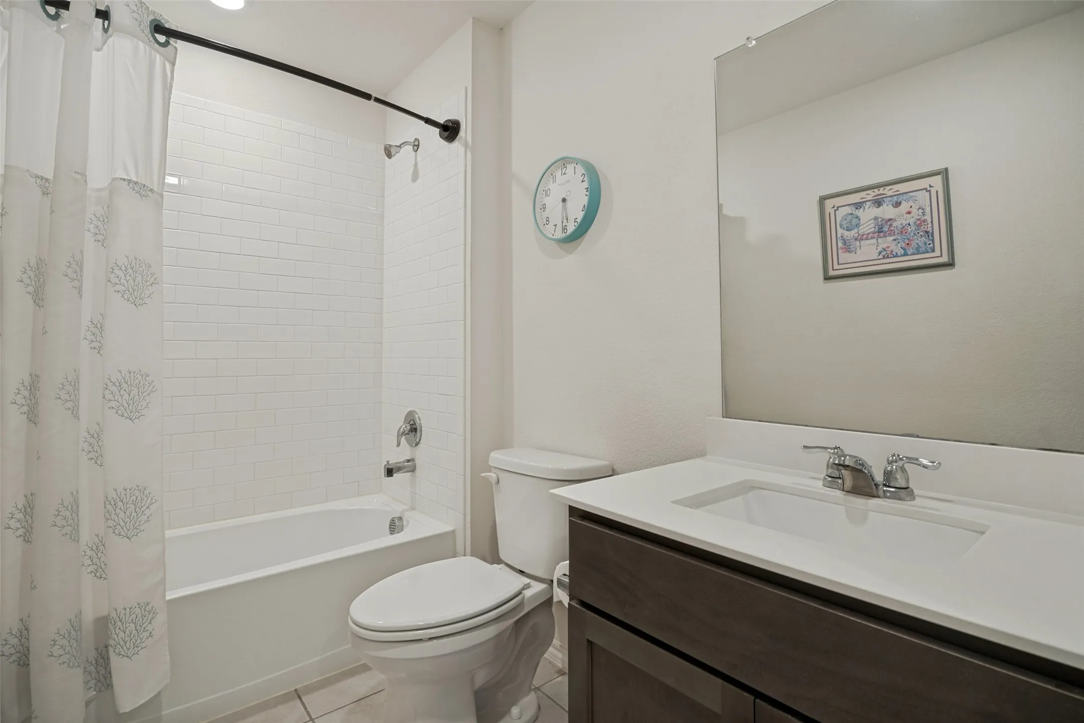 White subway tile shower surround with chrome fixtures