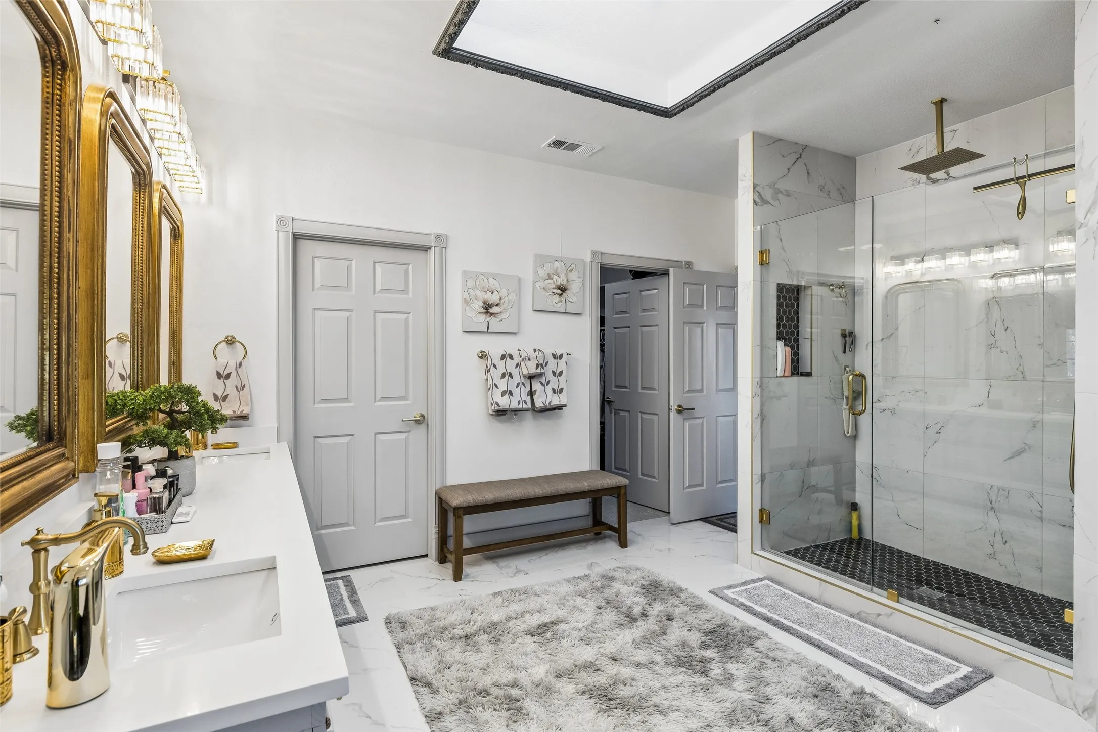 Dual vanity with integrated sinks and gold-tone fixtures