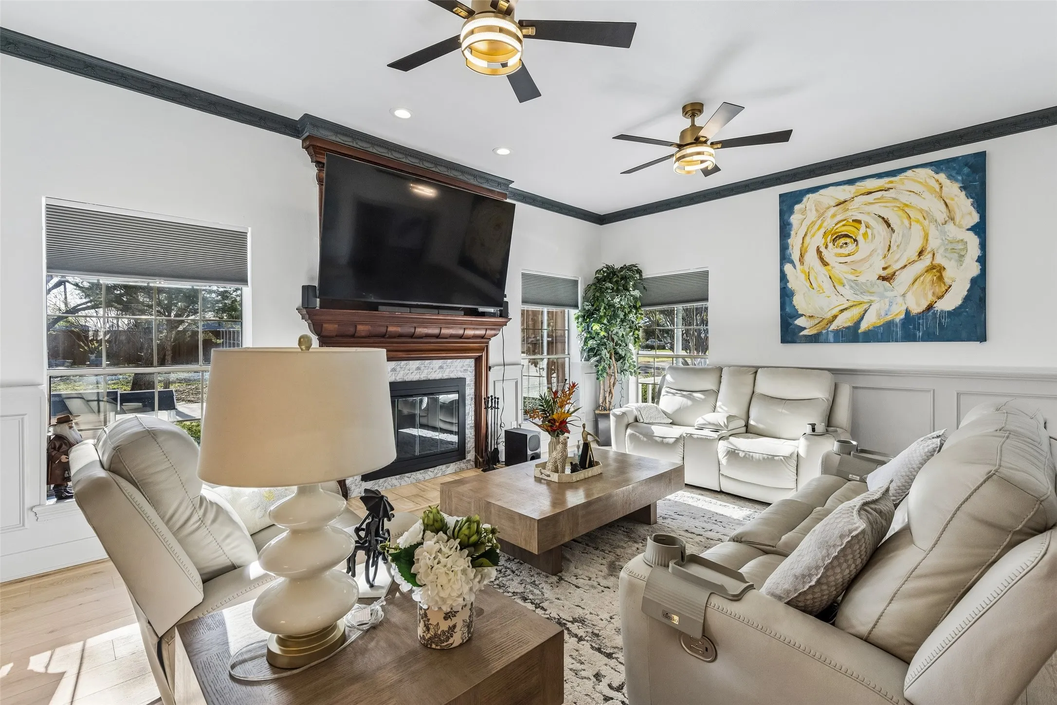 Wood-finish flooring, recessed lighting, and crown molding