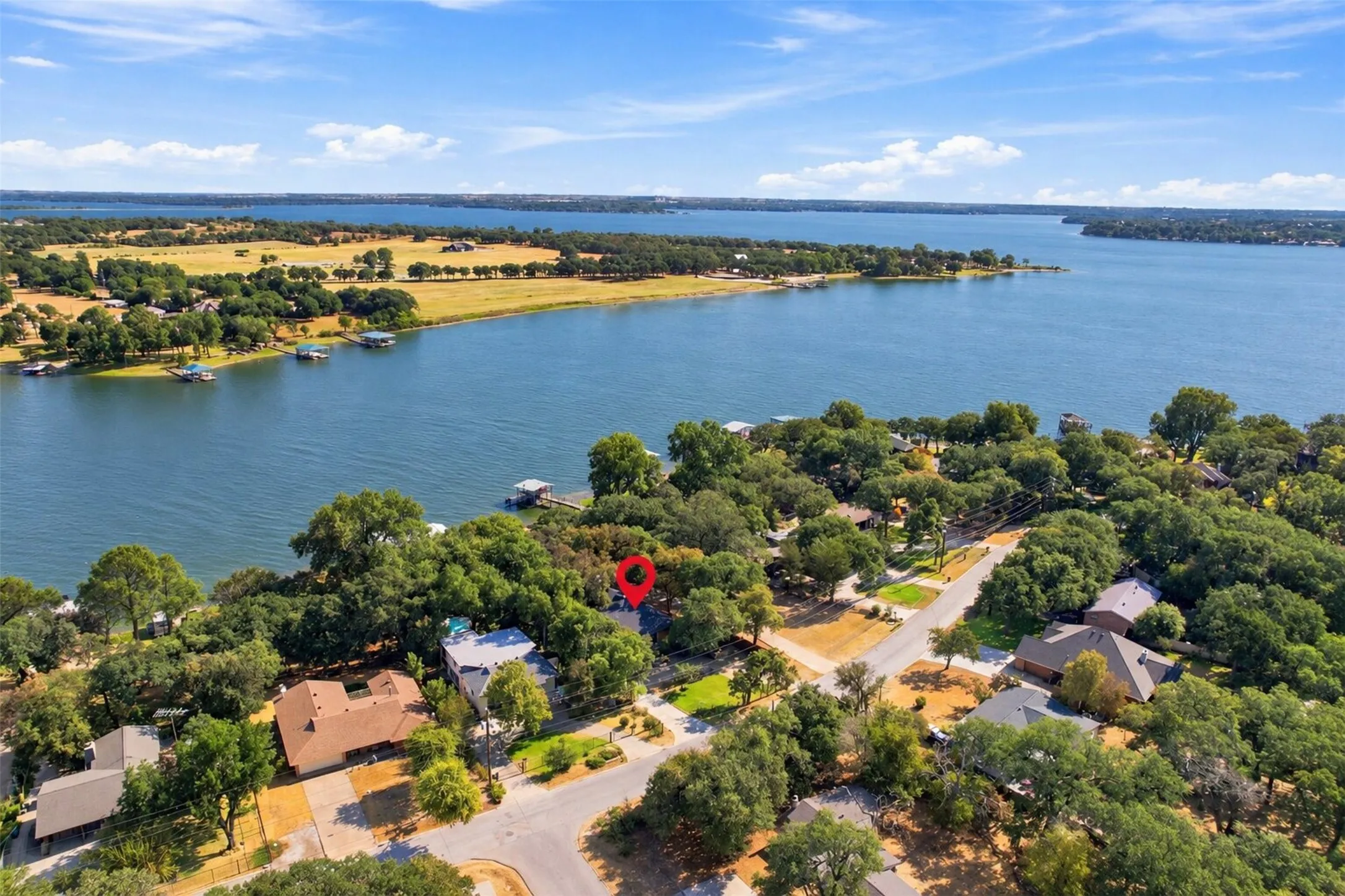 Waterfront community with mature trees and direct water access