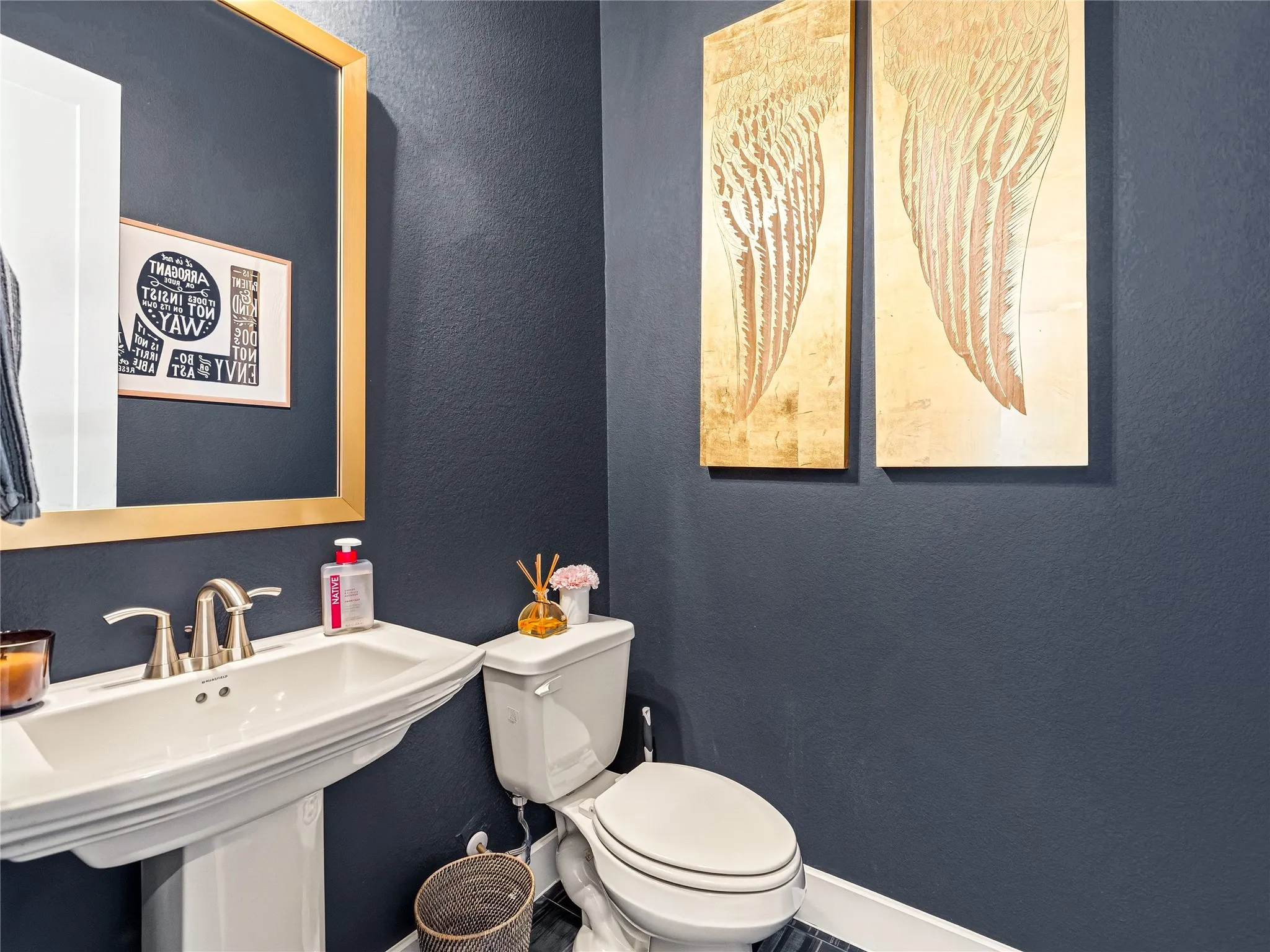 Pedestal sink with brushed nickel faucet
