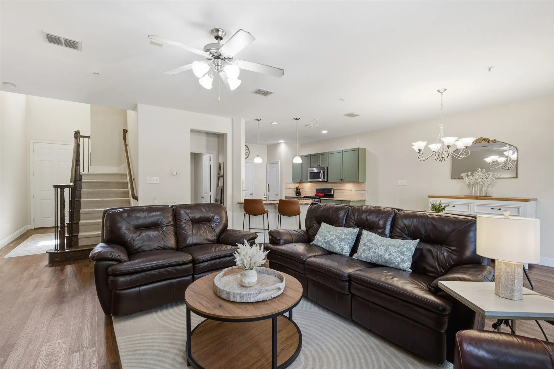 Spacious living area with wood-finish flooring