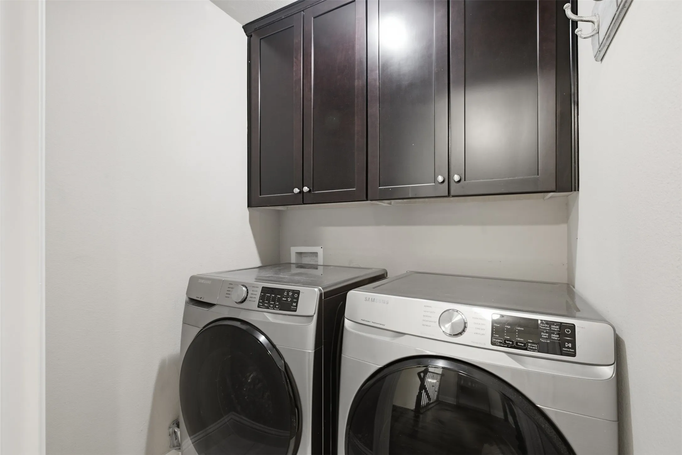 Built-in dark wood-finish cabinetry provides storage