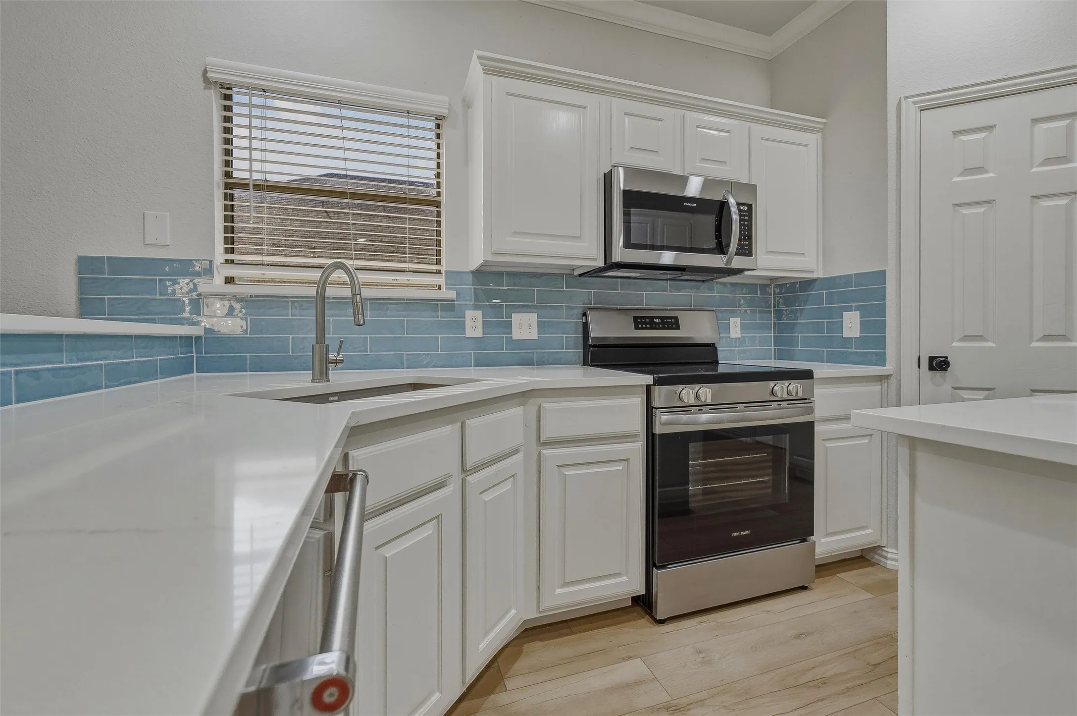 White cabinetry and light-toned countertops
