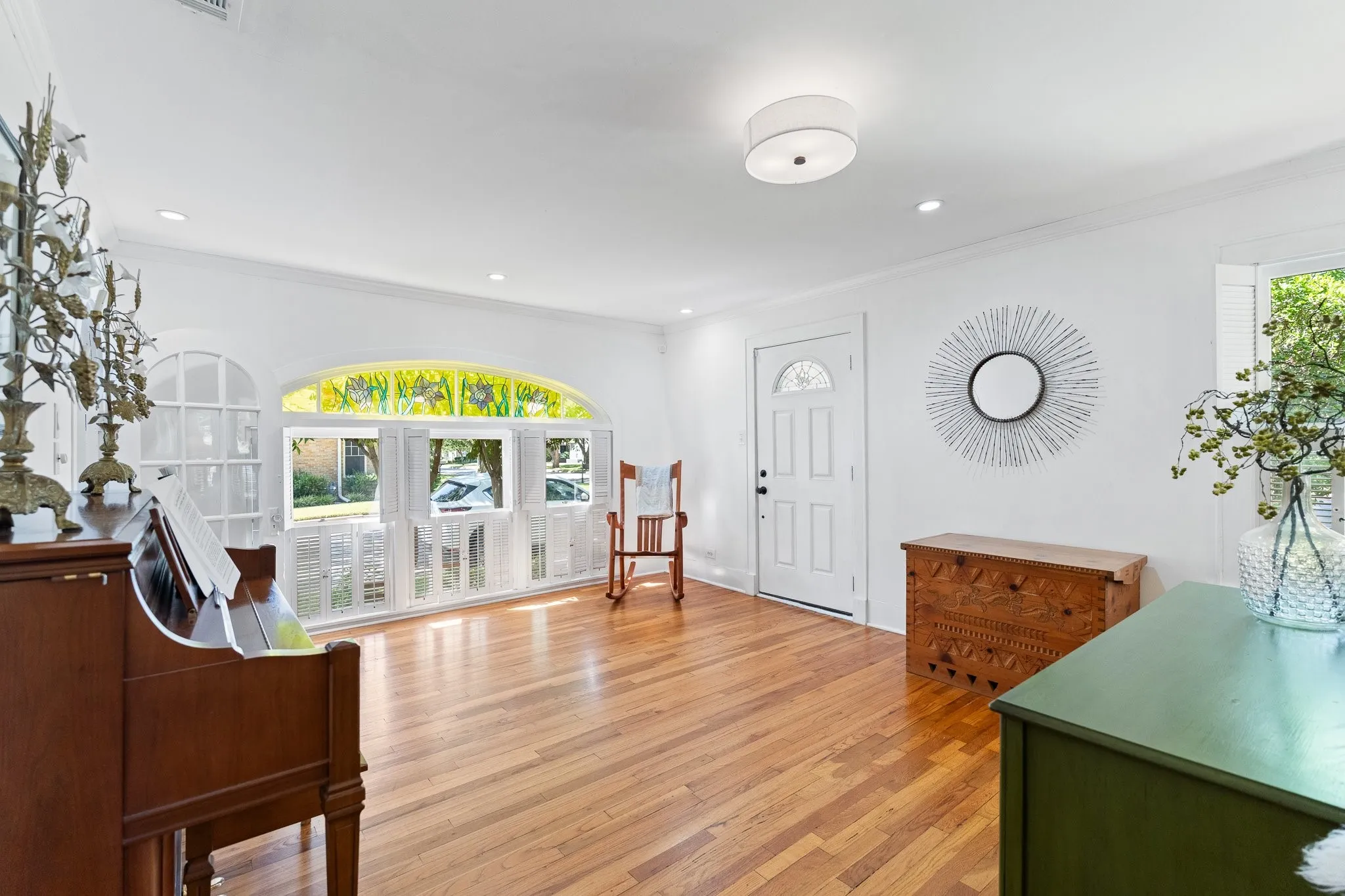 Here's another shot of the front entrance. Check out the cute shutters and the stain glass windows and round door on the left!
