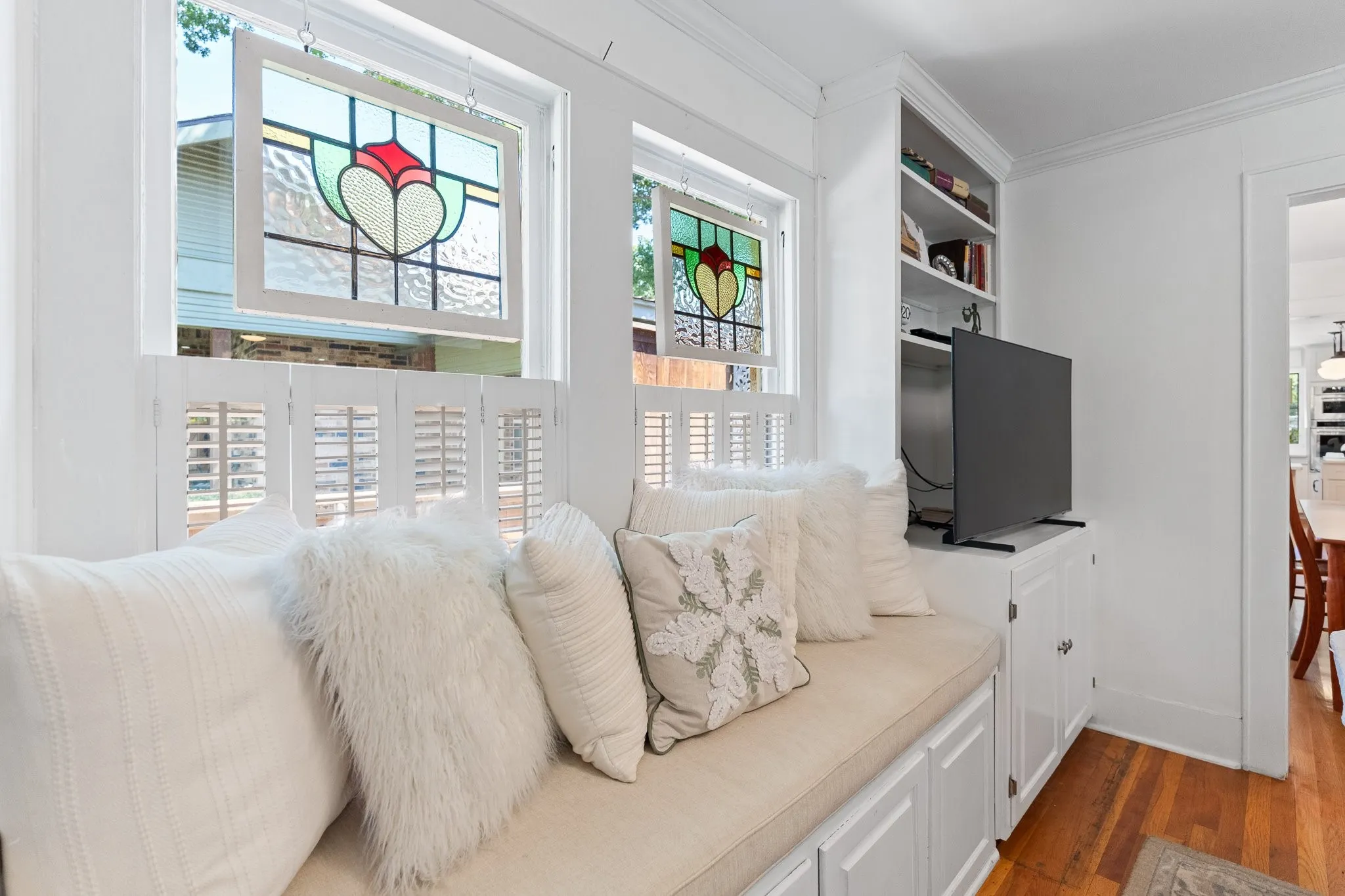Here's a nice window seat with storage underneath! Stained windows add a special touch!