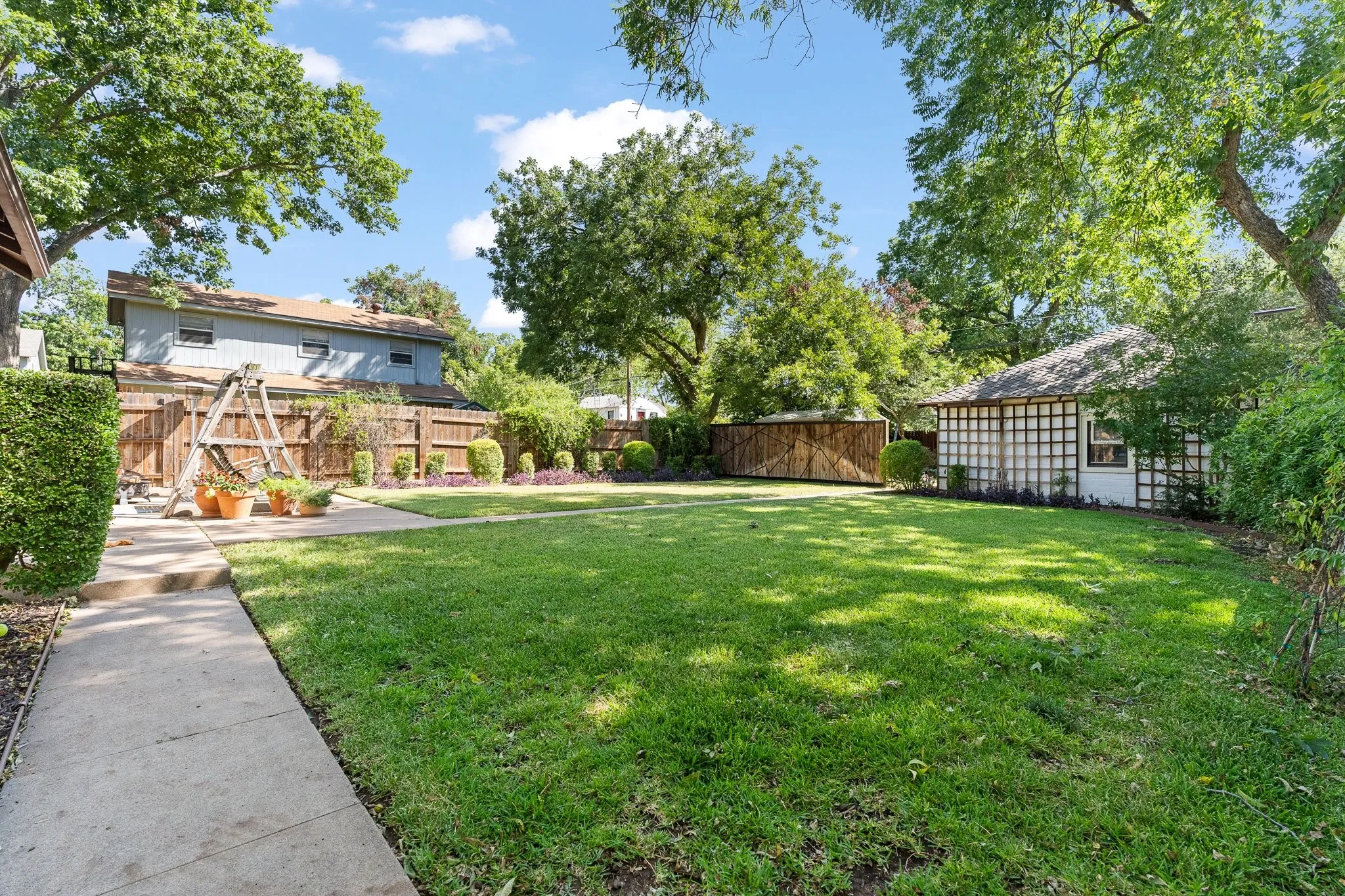 Back yard has tons of pecan trees and has been professionally landscaped.