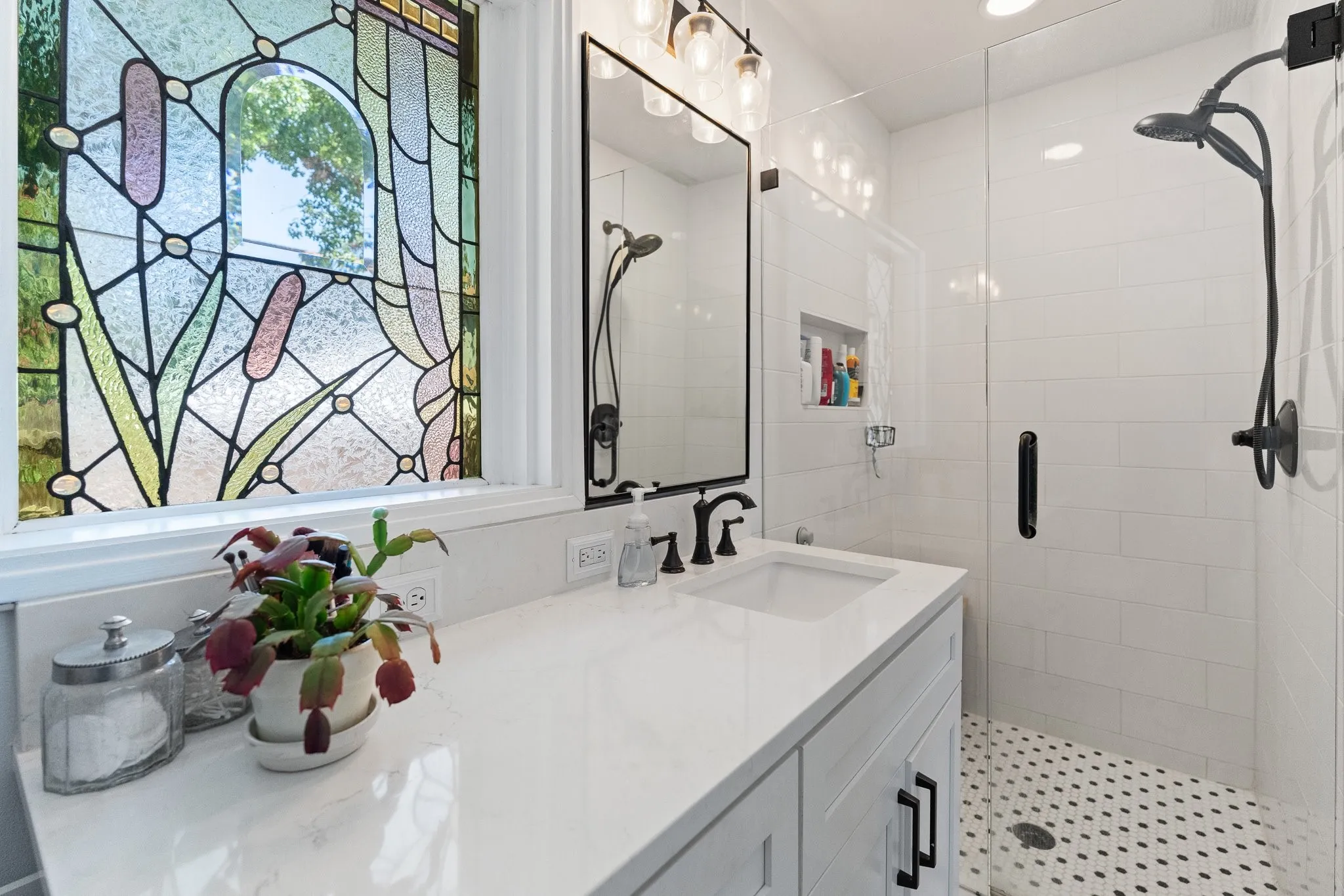 This is the cutest little primary bathroom. No tub, just a shower, but everything has been redone!
