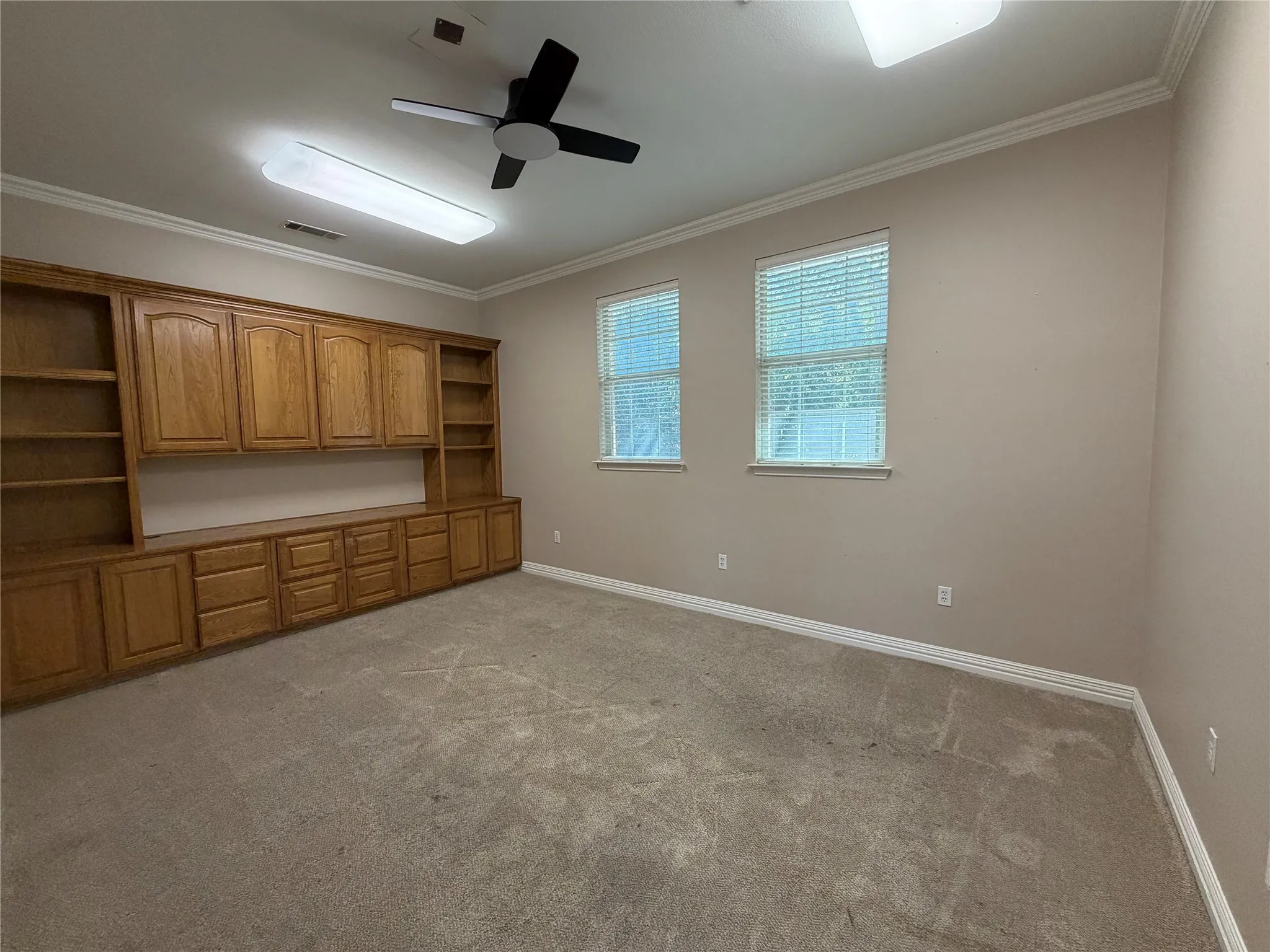 Large conference room (right side of hallway from entry) with built-in cabinets