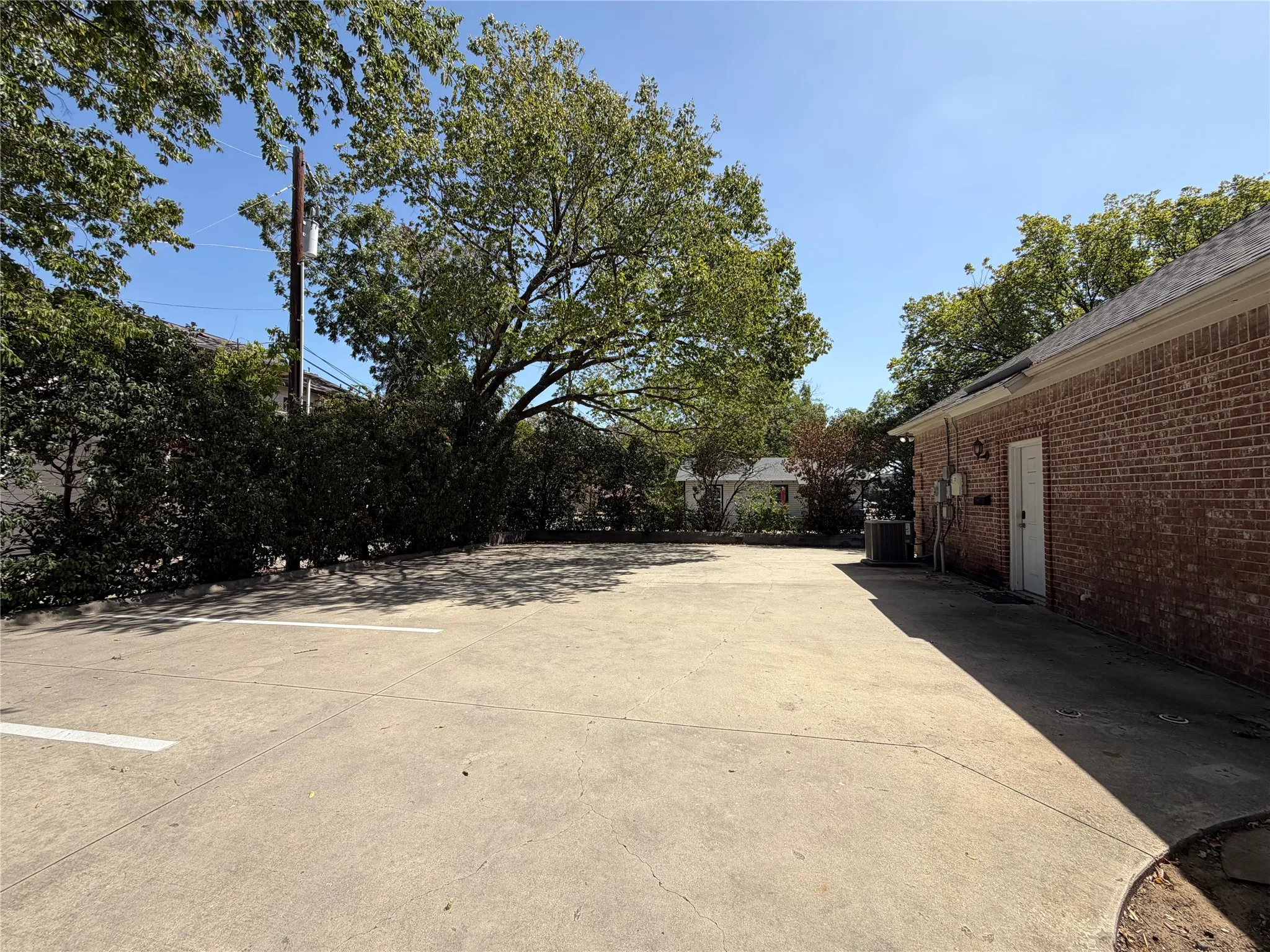 Rear of building and parking area with 7 parking spaces.