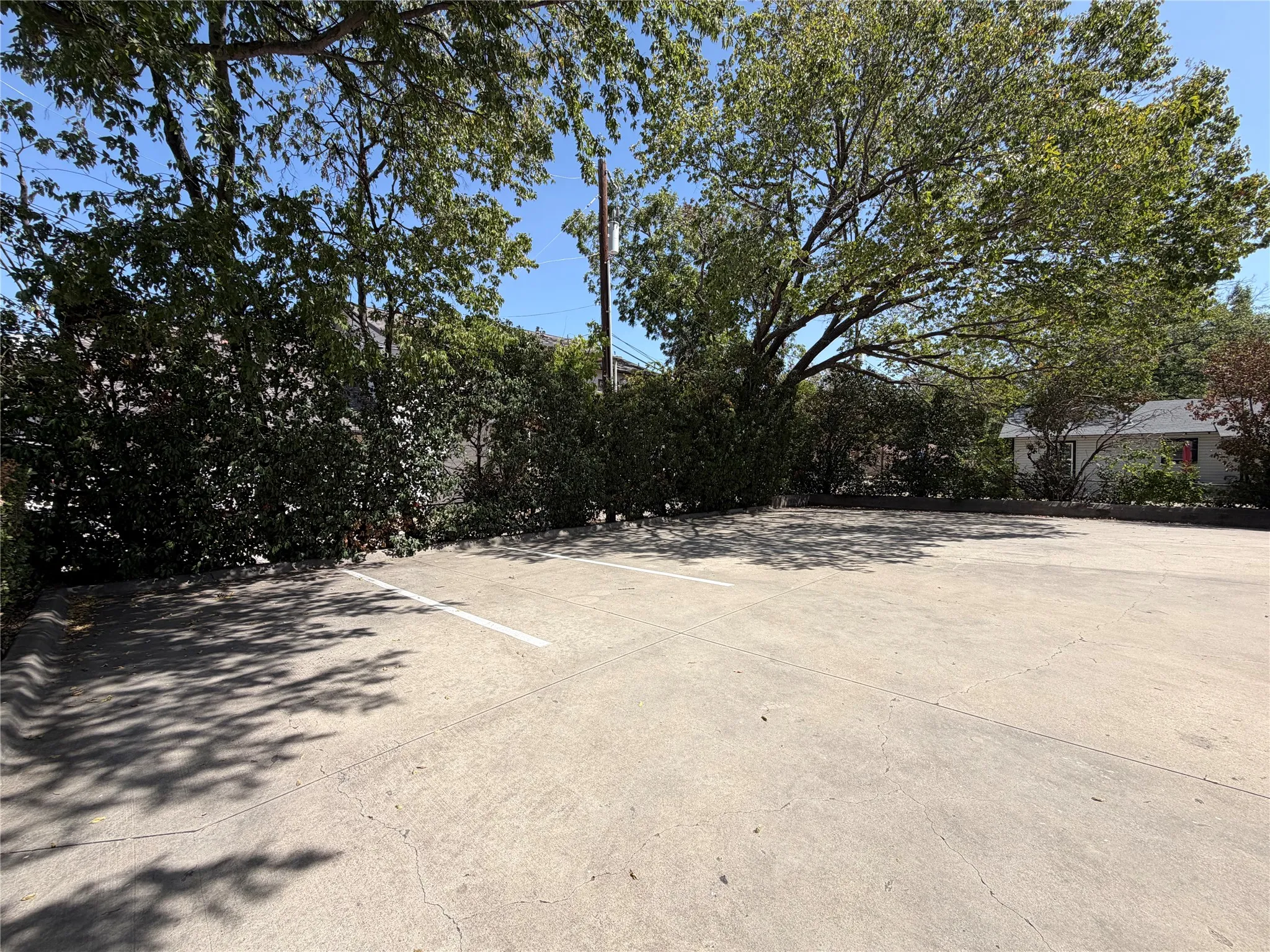 Rear of building and parking area with 7 parking spaces.