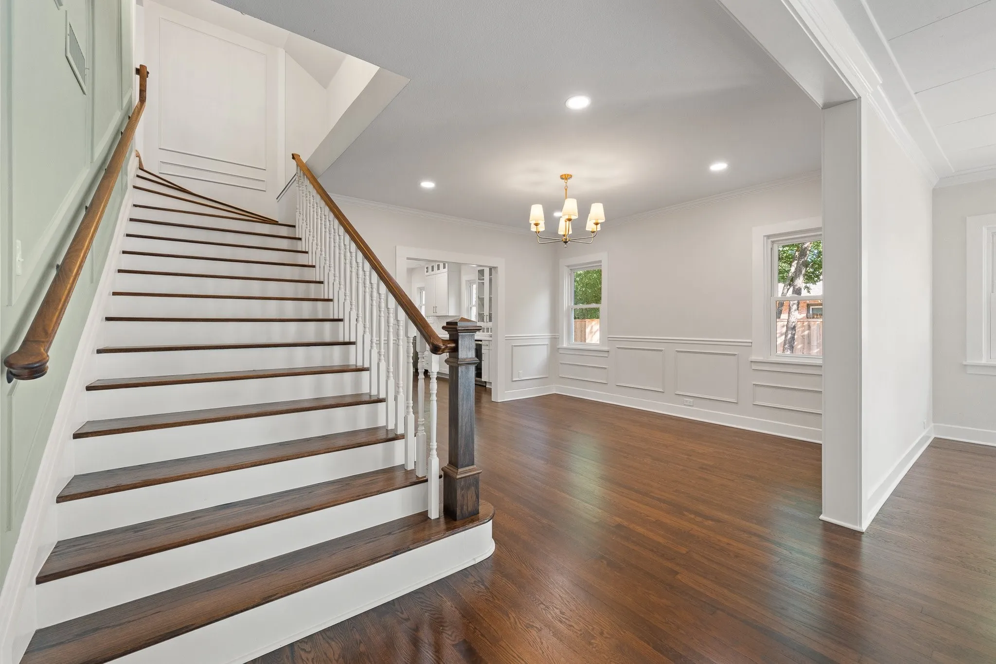 Look at this grand staircase with hardwood steps. It's the focal point of the home.