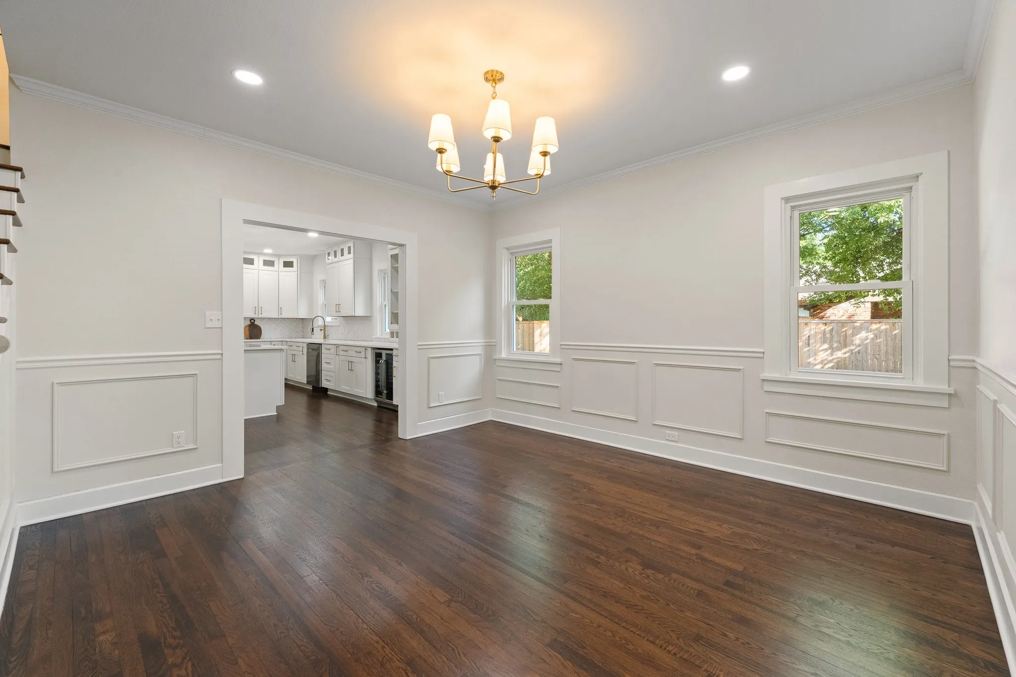 Look at this huge dining room with recessed lighting and real hardwood floors!