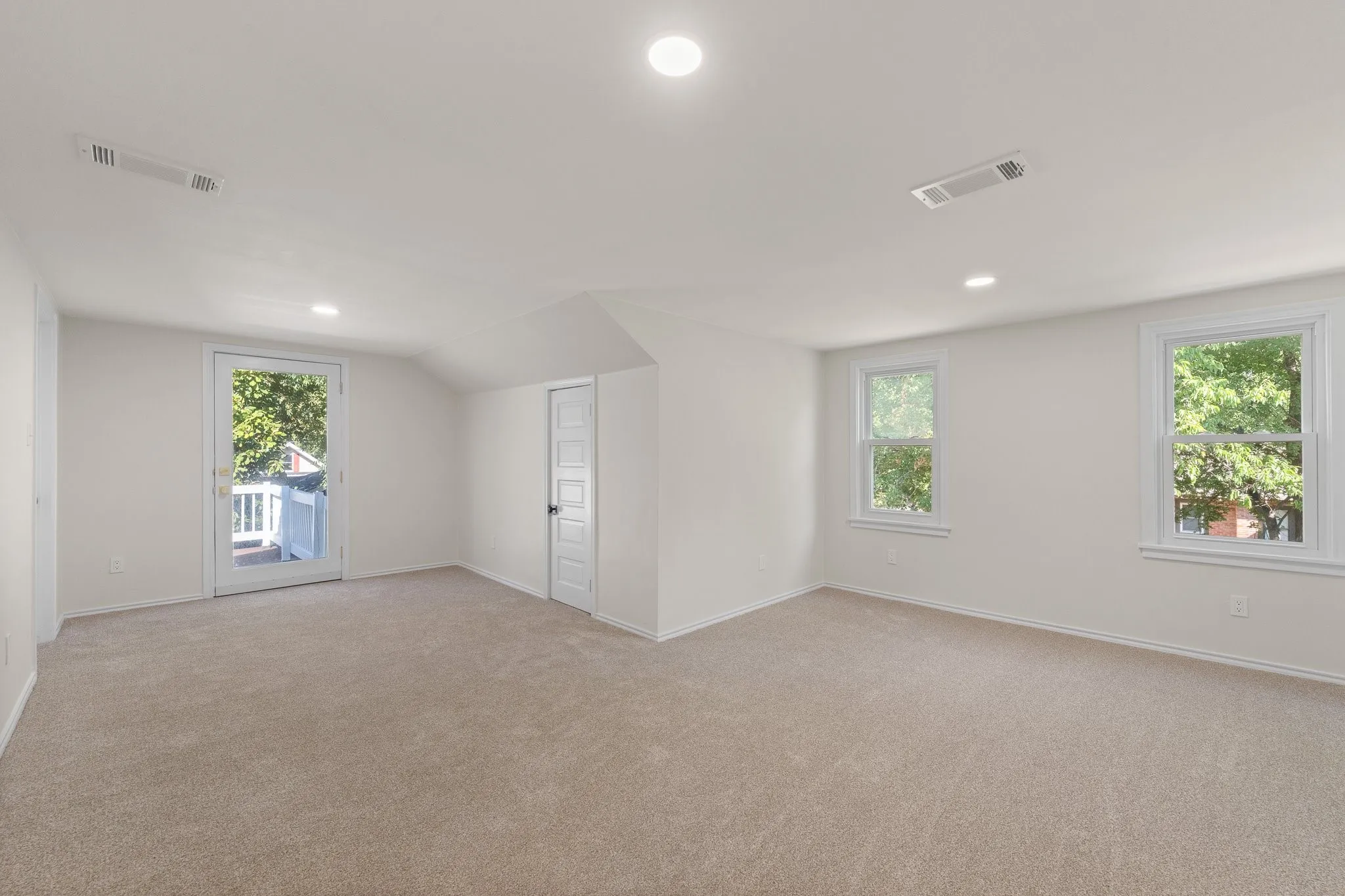 This upstairs bedroom is just off the open den area at the top of the stairs. This one is special because it has its own door and balcony to a nice deck.