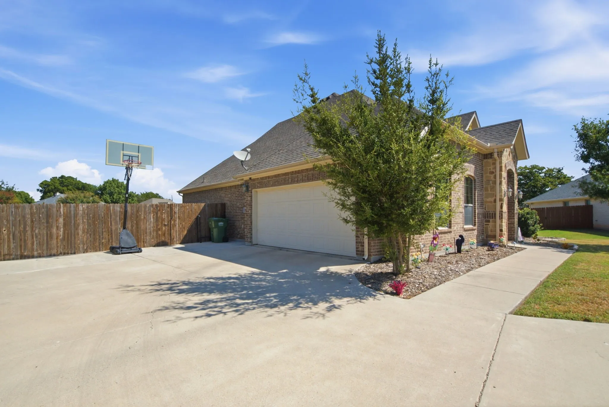 SIDE ENTRANCE INTO VERY ROOMY GARAGE