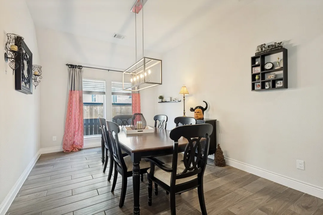Vaulted ceiling, wood-finish flooring, and recessed lighting