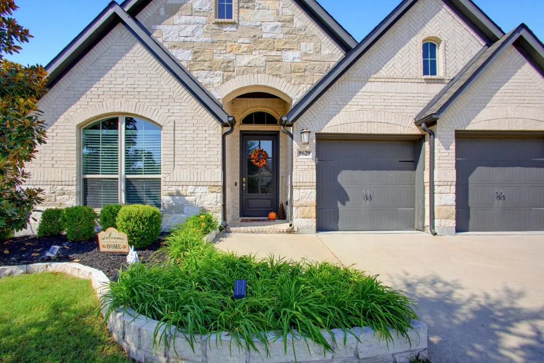 Stone and brick exterior with arched entry