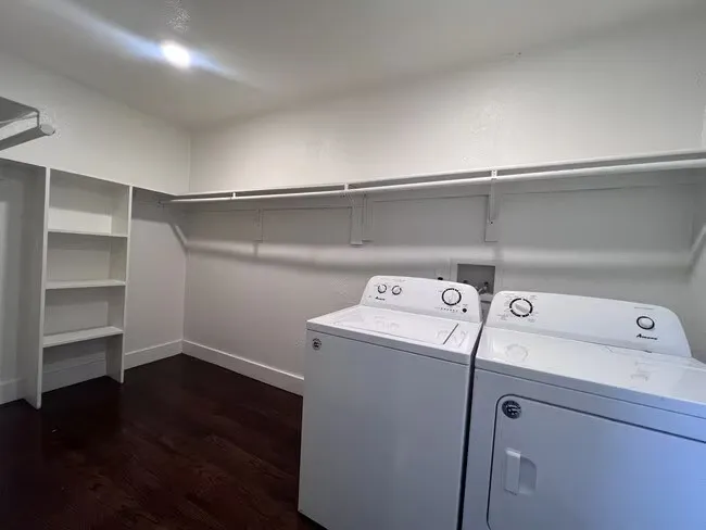 Built-in shelving, wood-finish flooring, and overhead lighting