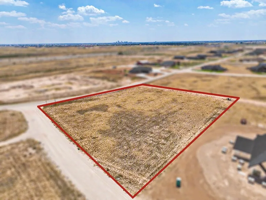 Expansive open lot with marked perimeter