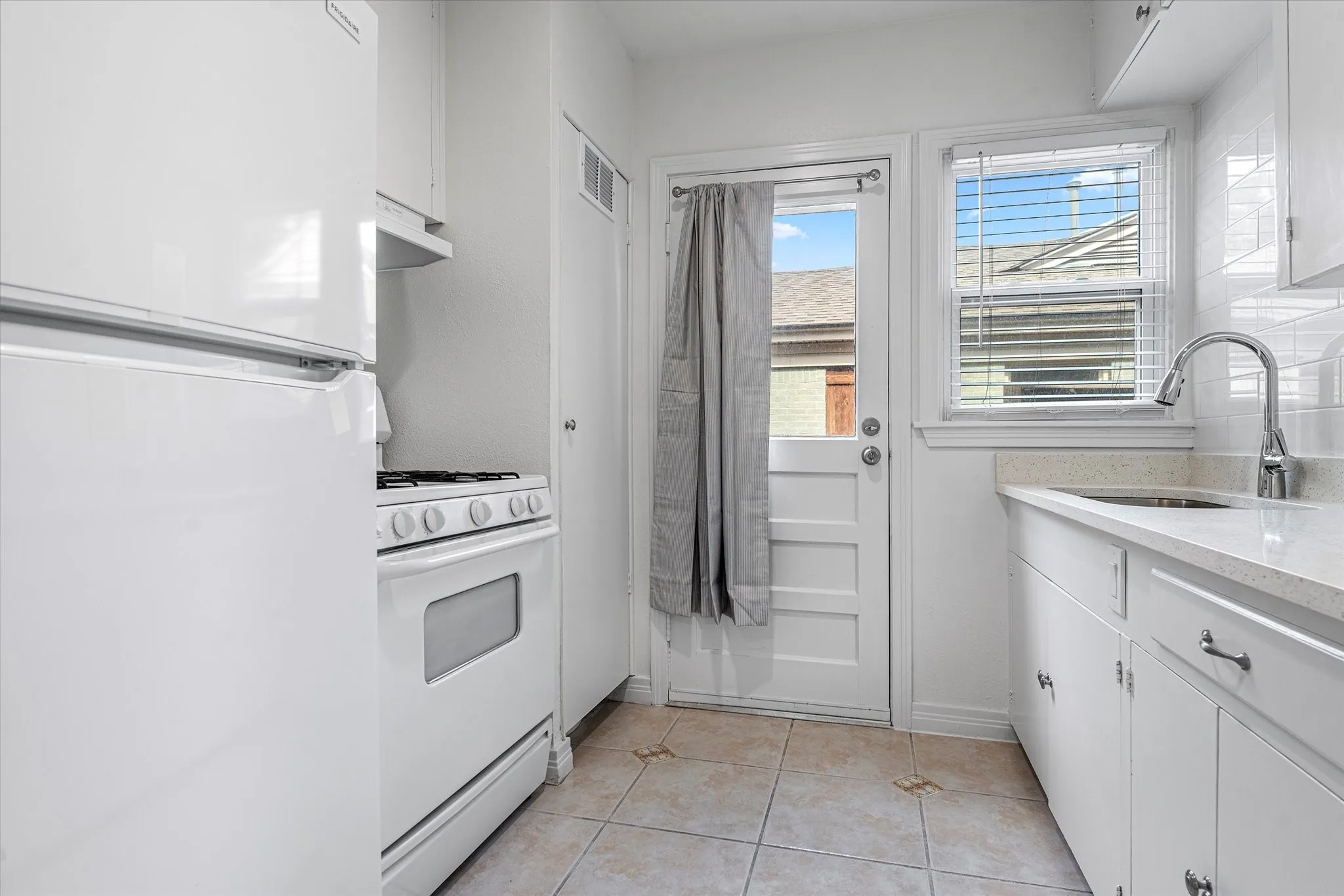 Galley Kitchen  - Outdoor Door To The Back Yard.