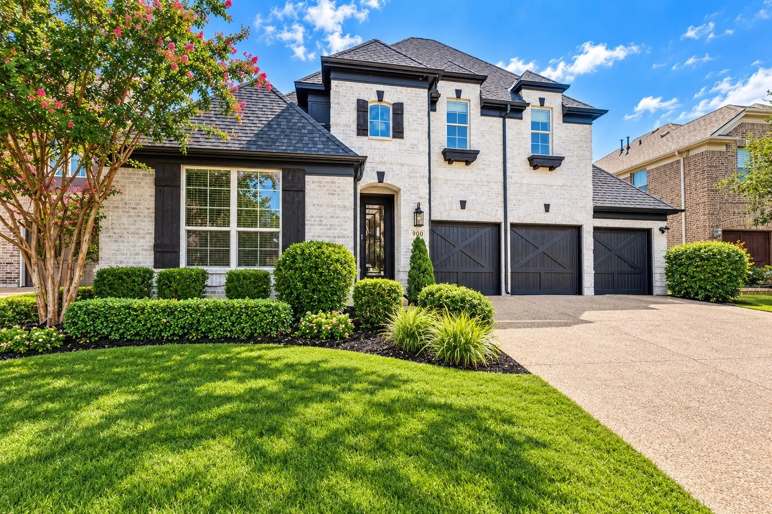 White brick exterior with dark trim accents