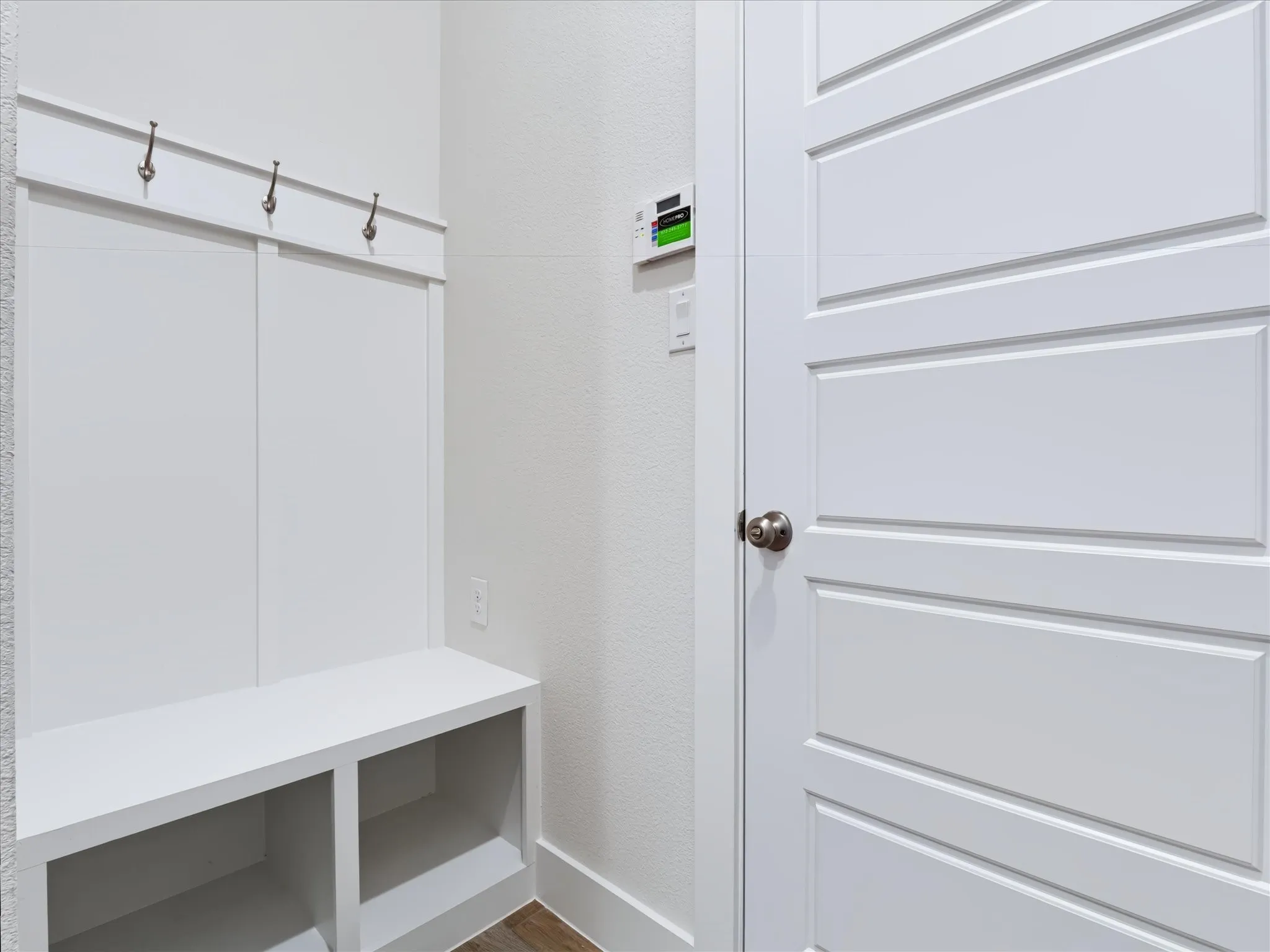 Built-in hall tree with storage bench and integrated hooks