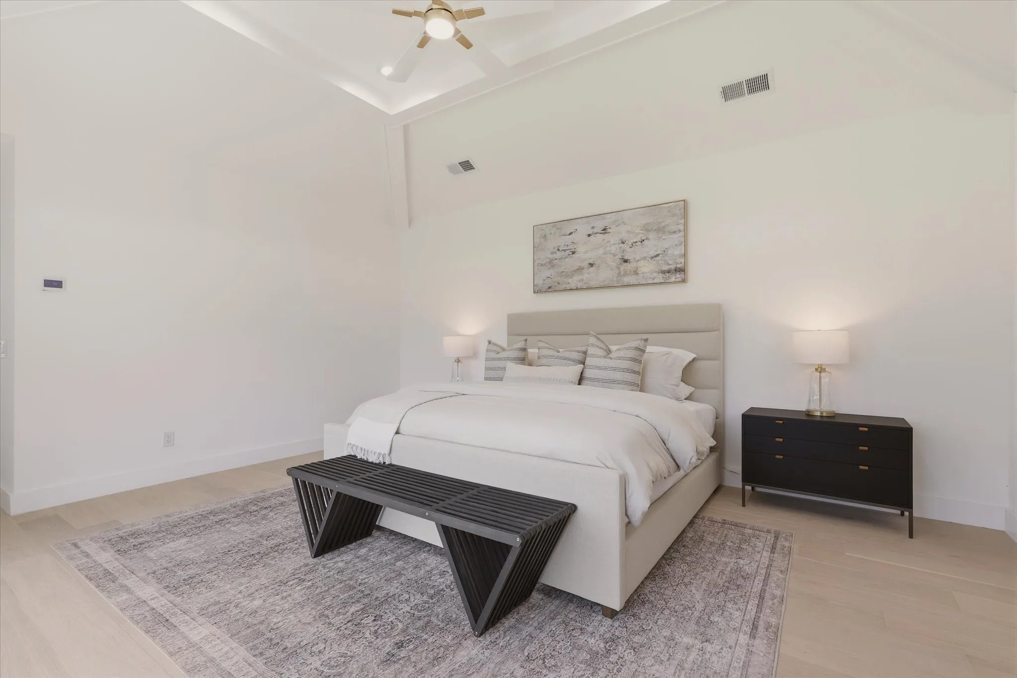 Vaulted ceiling with crown molding, ceiling fan, recessed lighting, and light wood-finish flooring