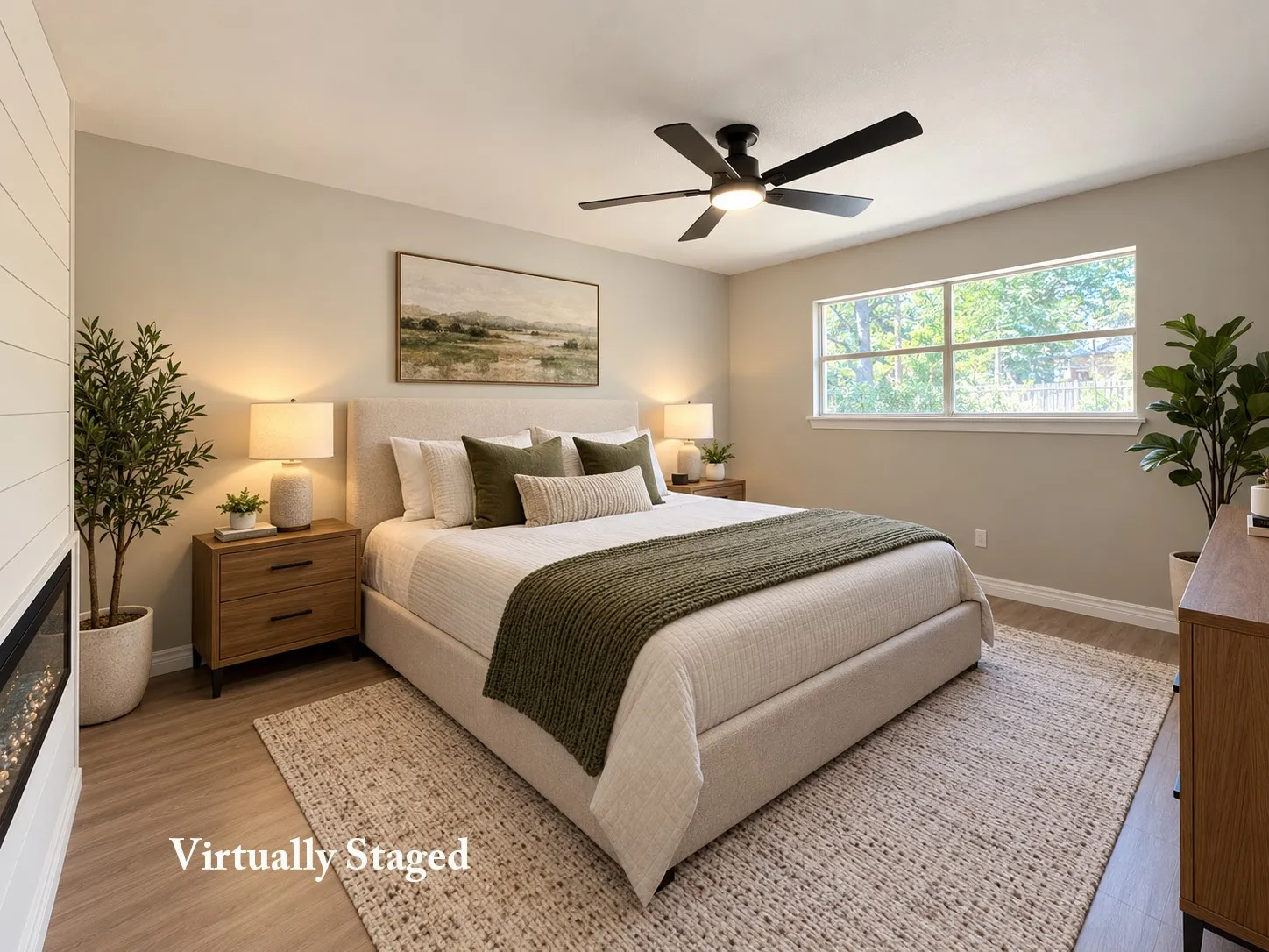 Wood-finish flooring, built-in electric fireplace with shiplap surround, large window, and ceiling fan with integrated lighting