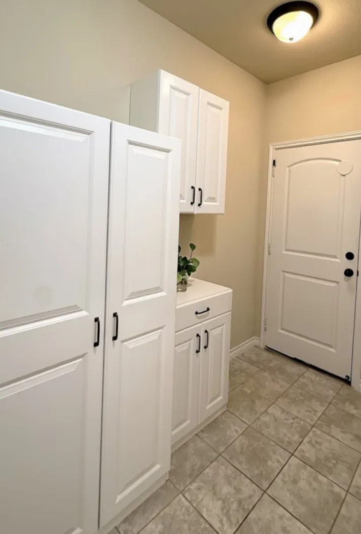 Extra storage in mud room area and door to garage