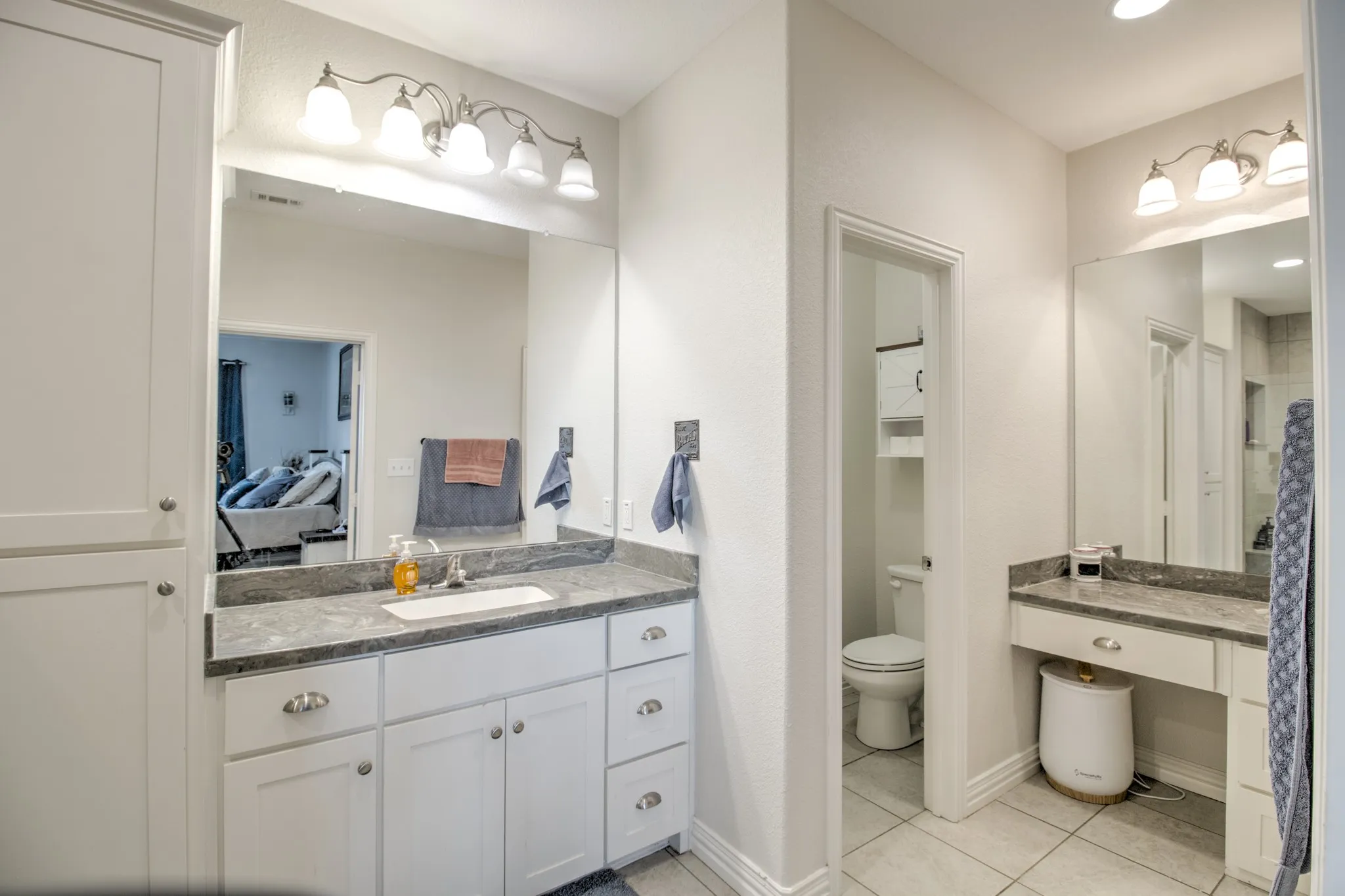 Primary bathroom with vanity and stand up shower.