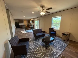 View from kitchen into Den and Backdoor