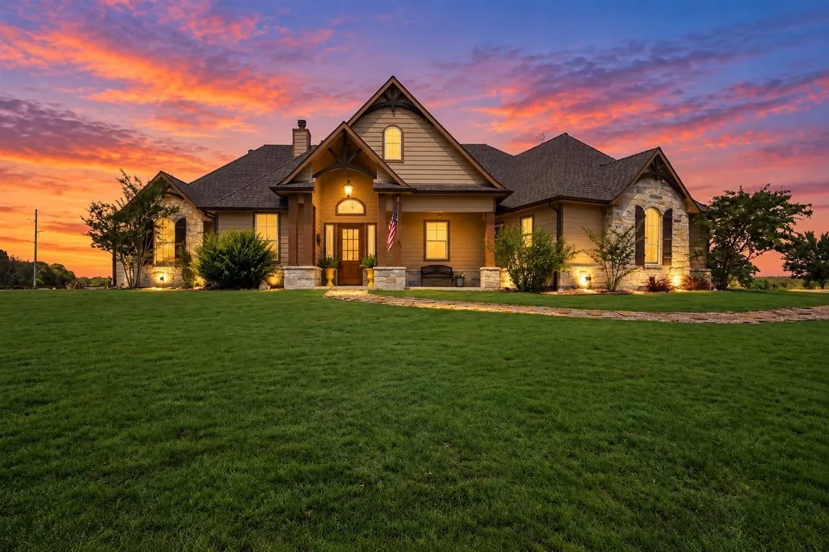 Stone and siding exterior with gabled roof lines