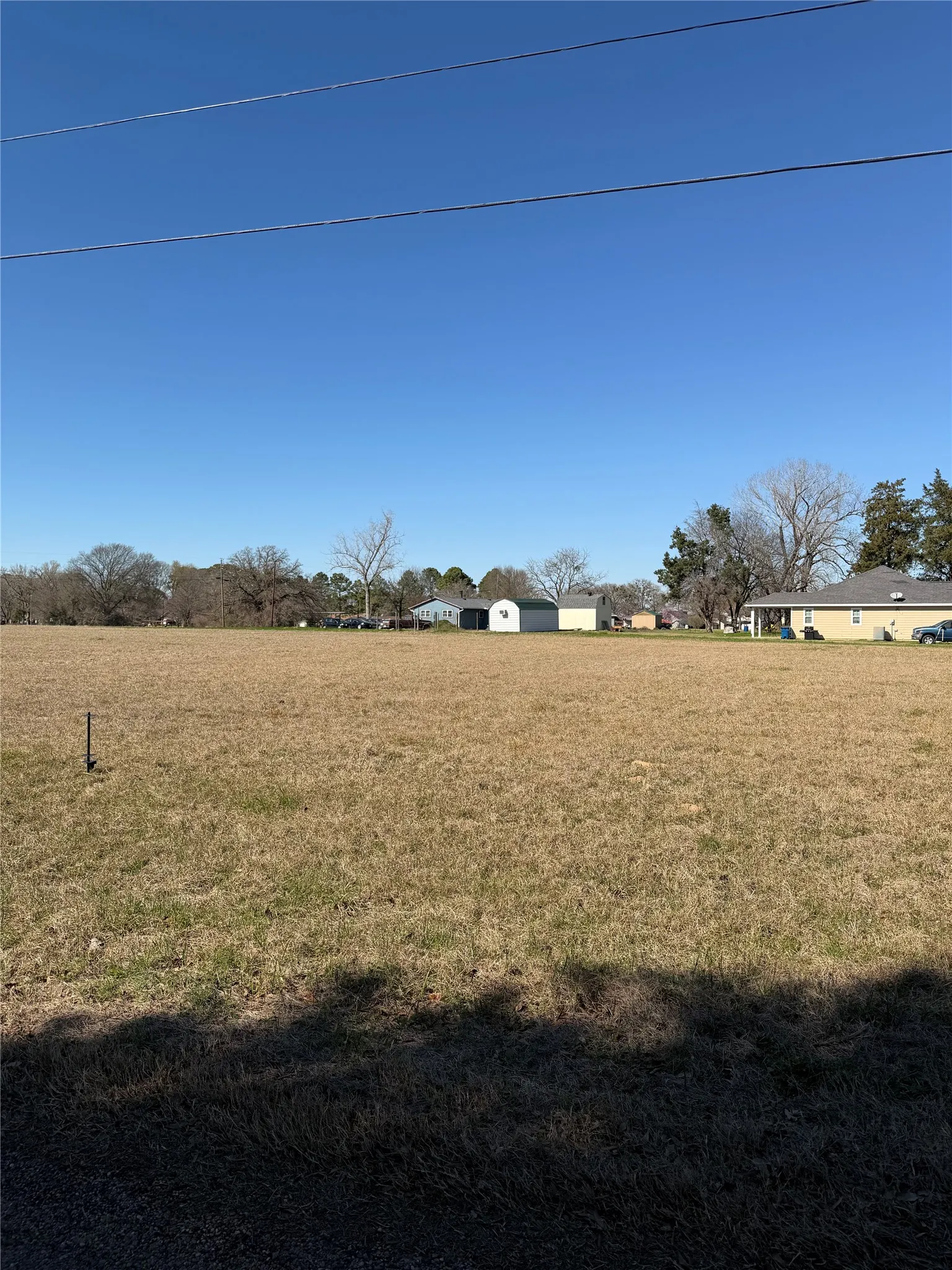 View of grassy yard with a rural view