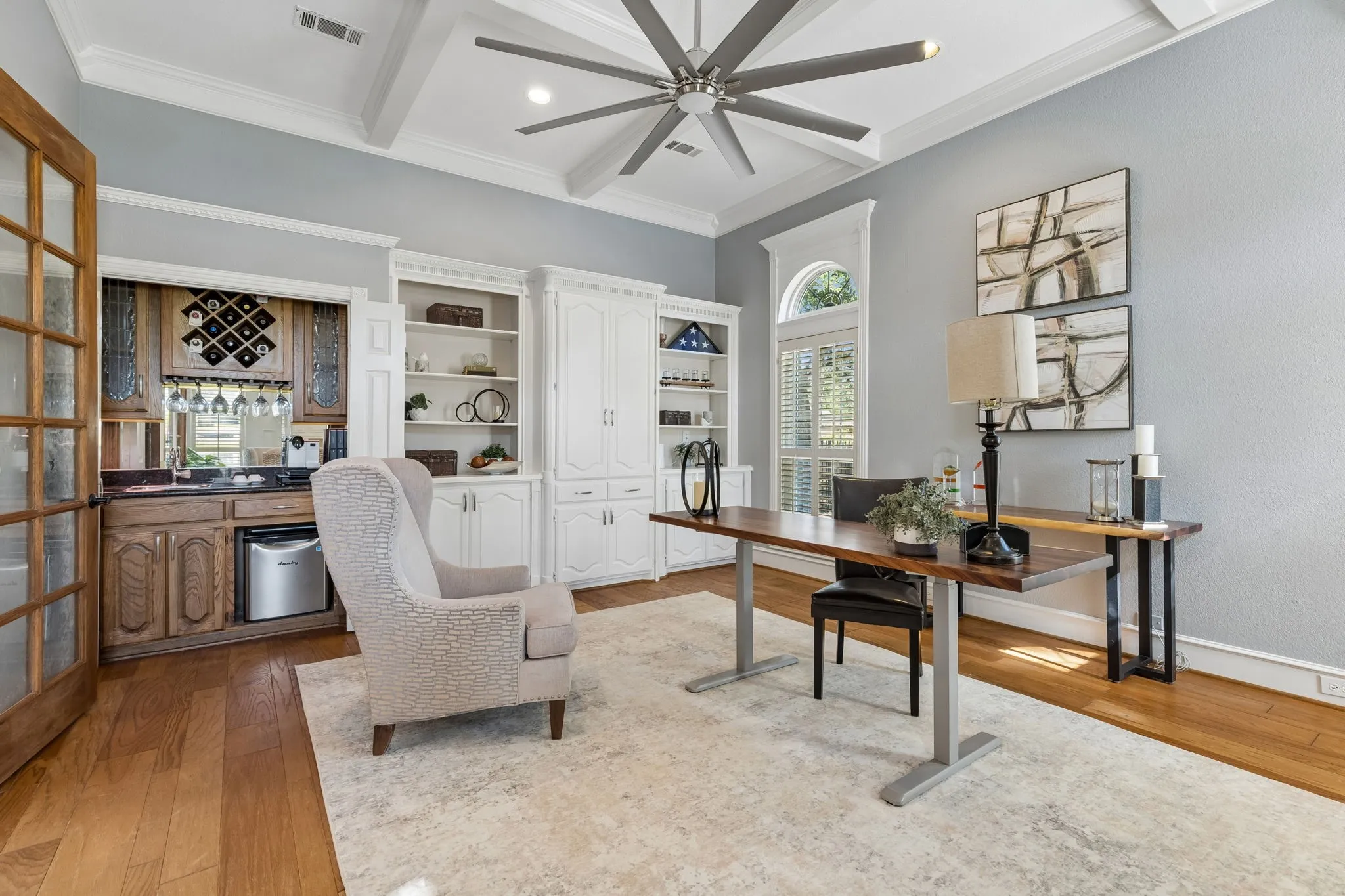 Living room with built ins and wet bar.