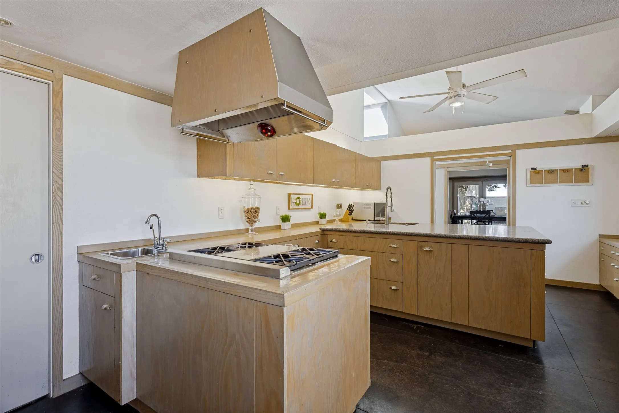 The range has a gas cooktop and a commercial style stainless vent above.  A prep sink is also available.  There is a very large pantry.