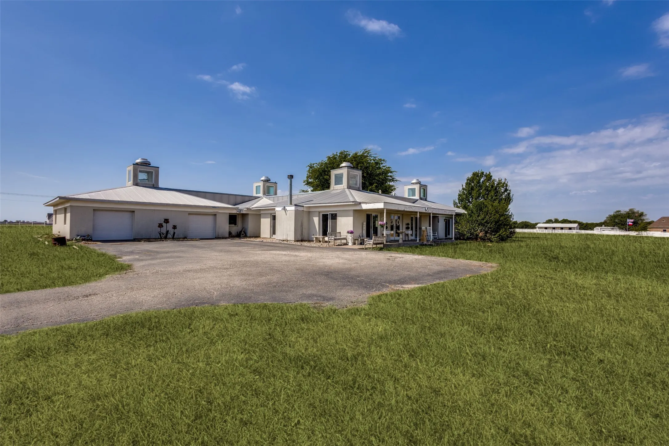 One outstanding feature of the home is the garage - over 1,000 square feet of space complete with ample electricals, a sink and four closets.  Car enthusiasts could add ramps in the space beyond the front bays to accommodate additional vehicles or use the space for a workshop, studio or hobbies.