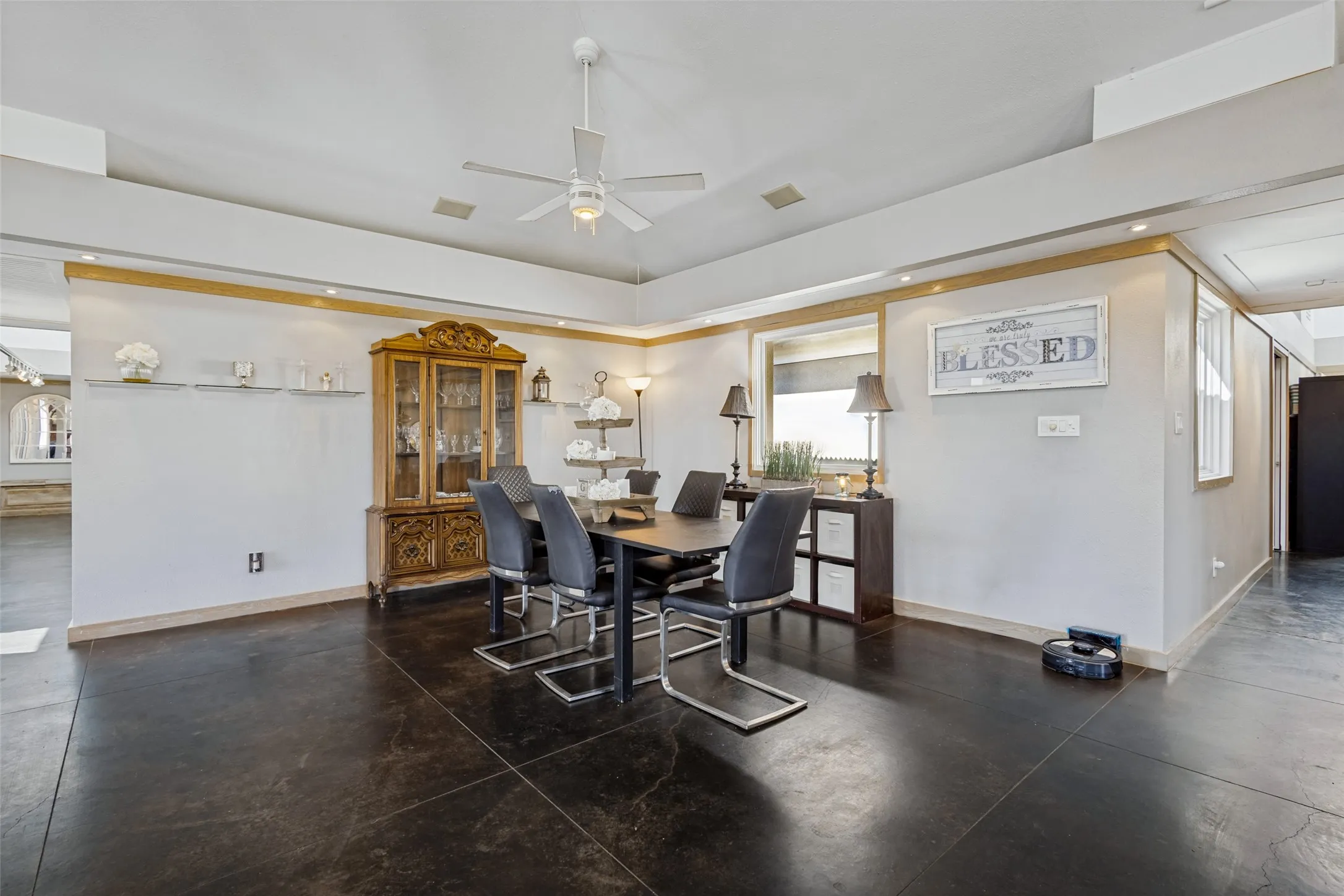 The home was designed with two wings angling off the central space.  Each wing has track lighting down the hallway and a skylight at the end.