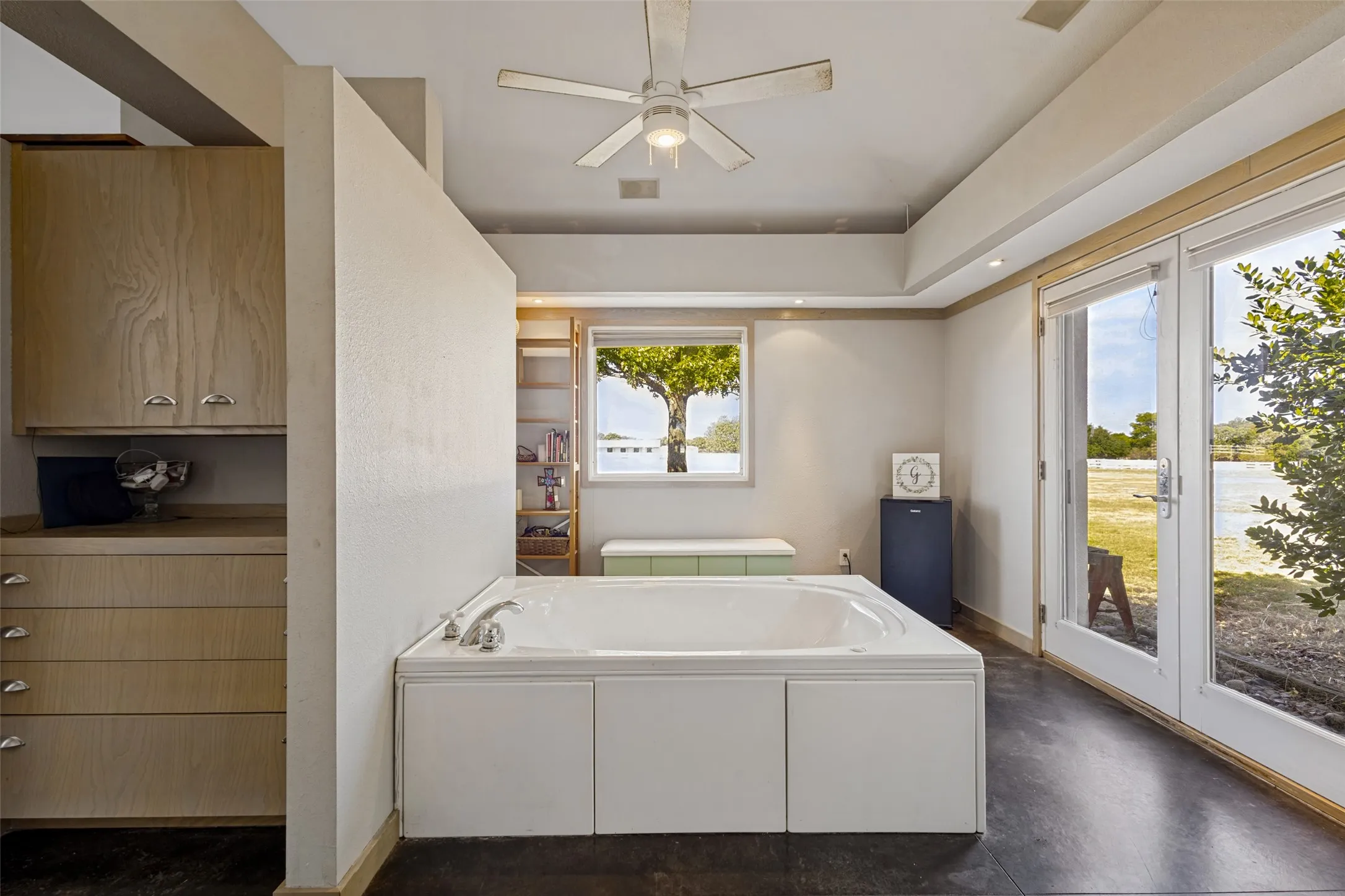 The primary bath is large and divided with separate vanity areas.  Whether you prefer a soaking bubble bath or a brisk shower, this primary bath offers both.