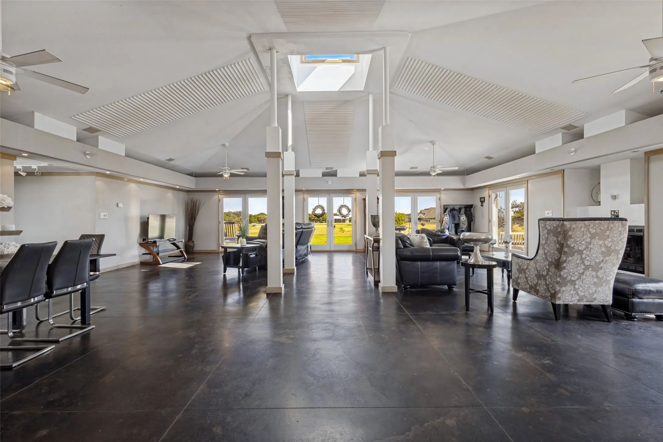 There are four ceiling fans to keep things cool - one in each section of the space.  Durable stained concrete floors keep maintenance easy.