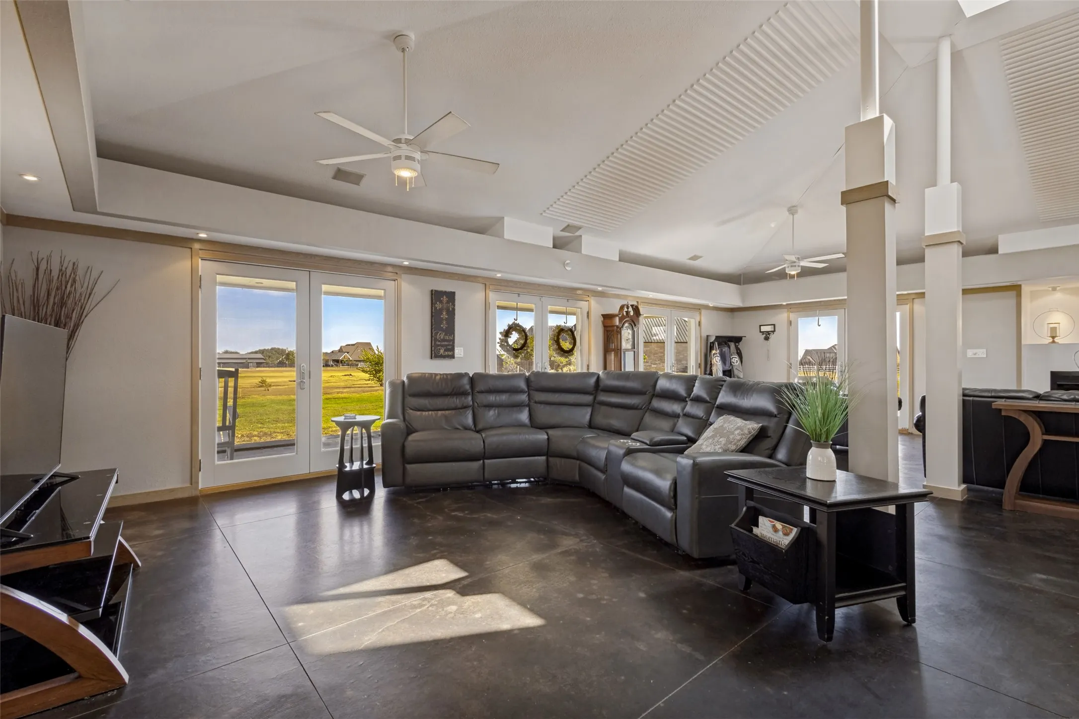 This section of the room has been designated for entertainment with plenty of room for media room seating and a wide wall for a large TV.