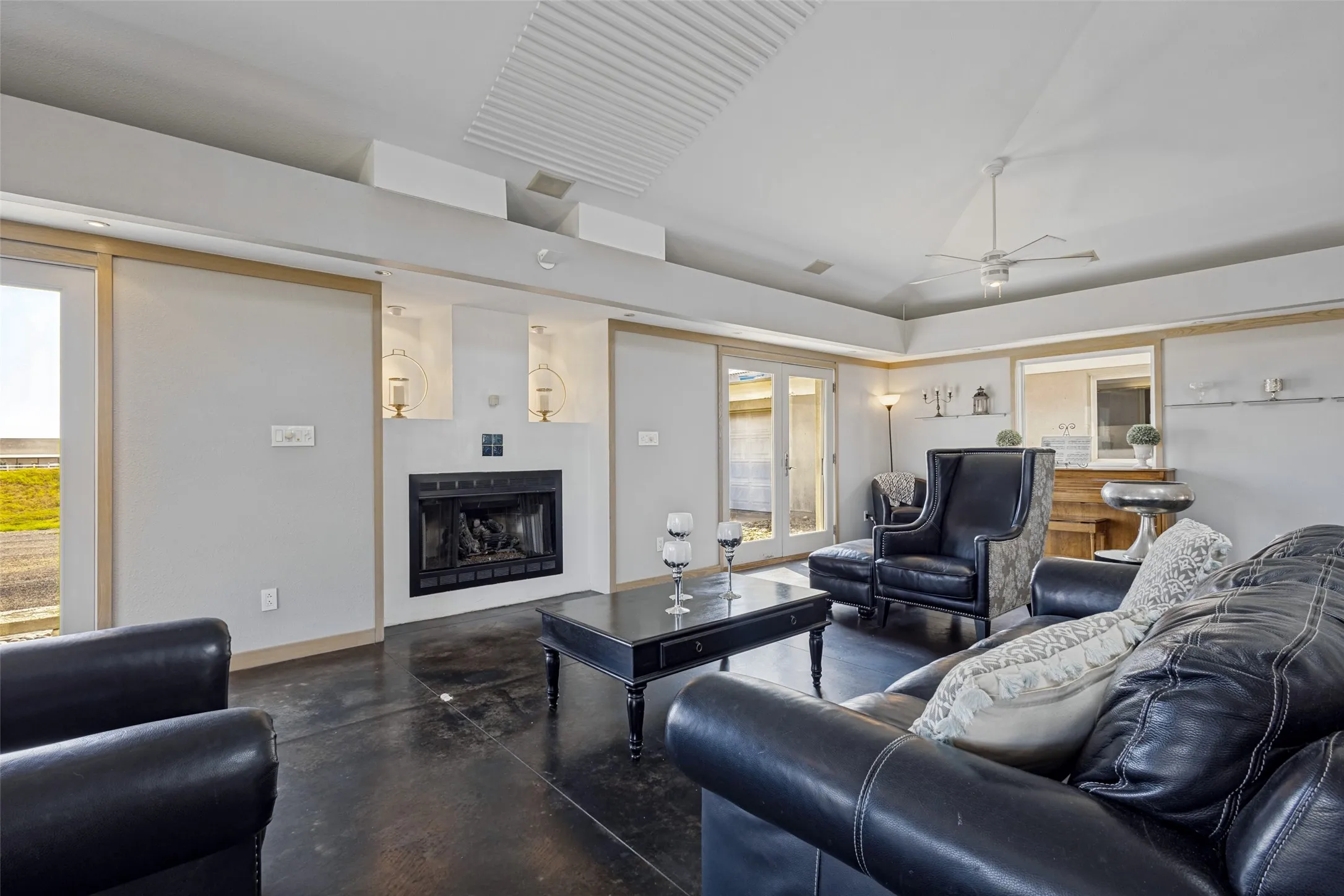 Friends and family can gather around the cozy fireplace with gas logs.  Fur downs circle the room and include accent lighting (Some sections may not work)  Natural wood trim decorates the walls and defines doors and windows.